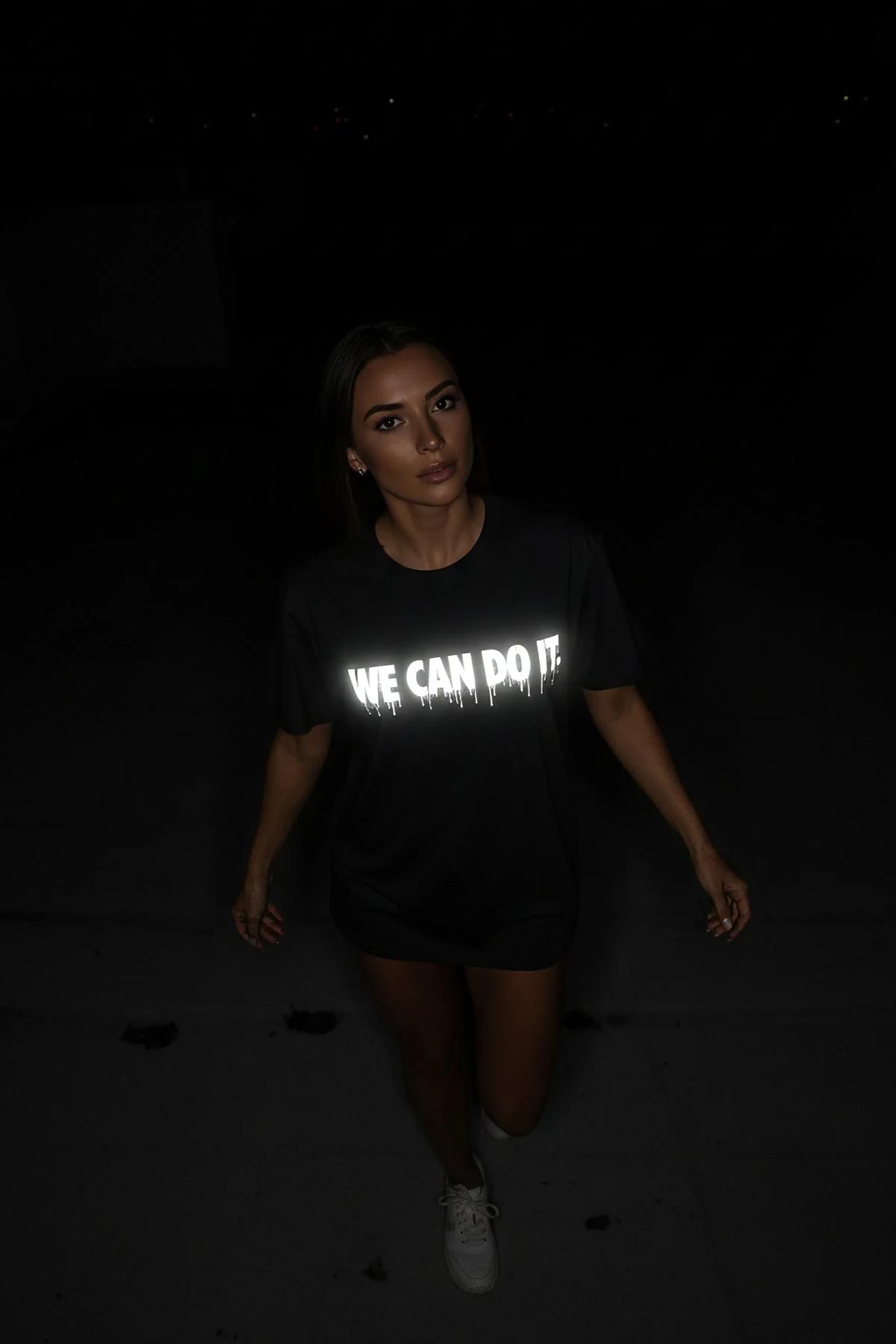 black reflective skull moth graphic t-shirt oversized fit bright white print under direct light