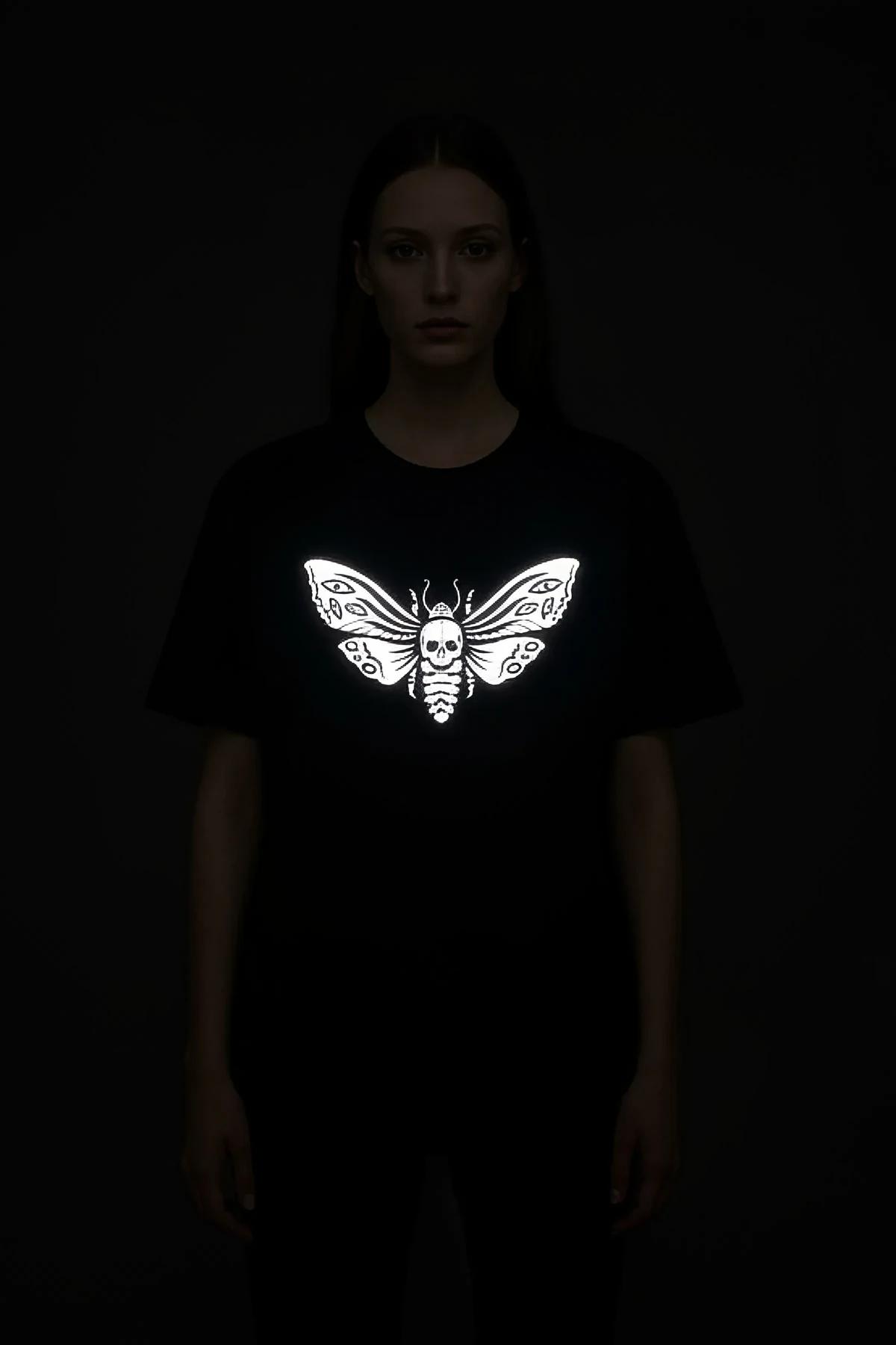 black reflective skull moth graphic t-shirt oversized fit bright white print under direct light