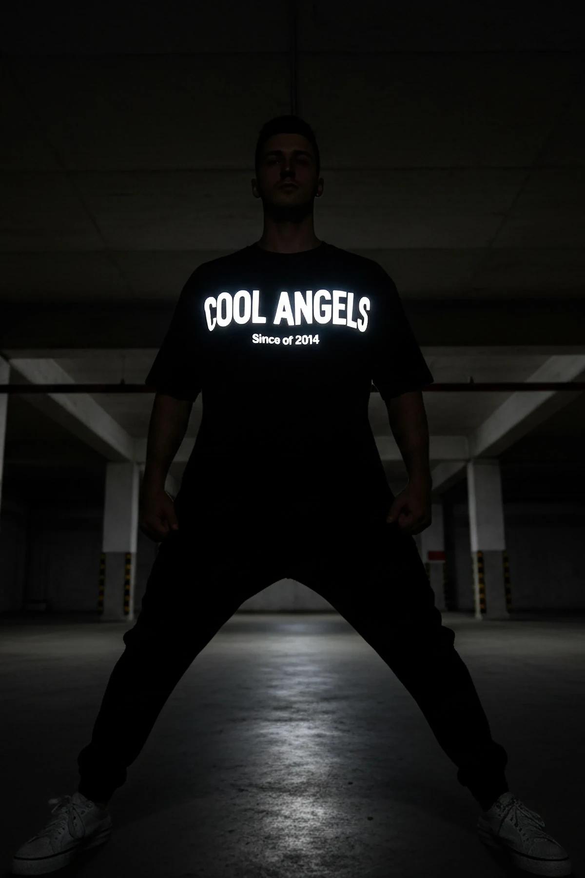 front view black cotton graphic tee showing reflective Since of 2014 subtitle under COOL ANGELS logo