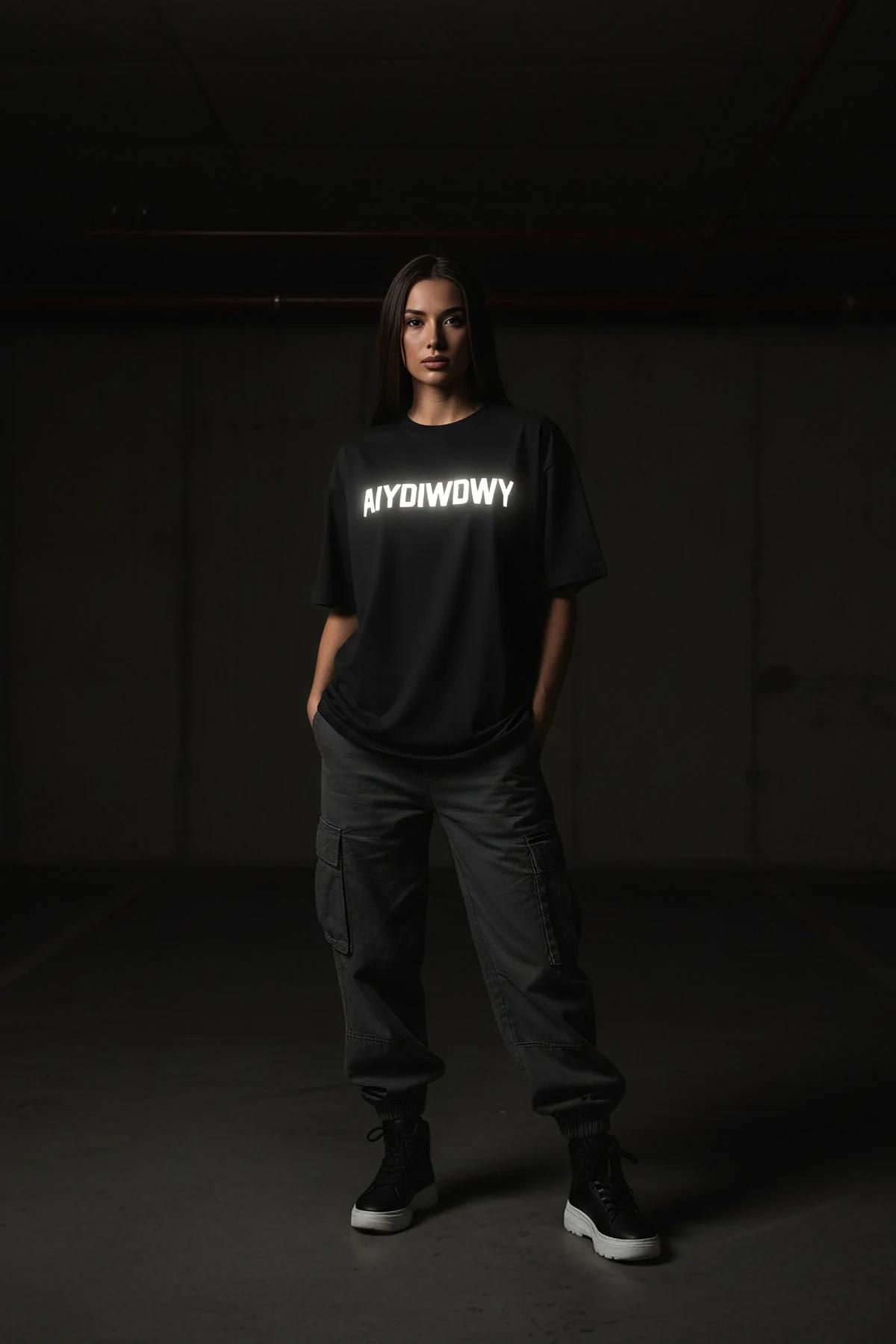 black oversized cotton t-shirt with white reflective custom block-letter chest print, drop-shoulder street fit