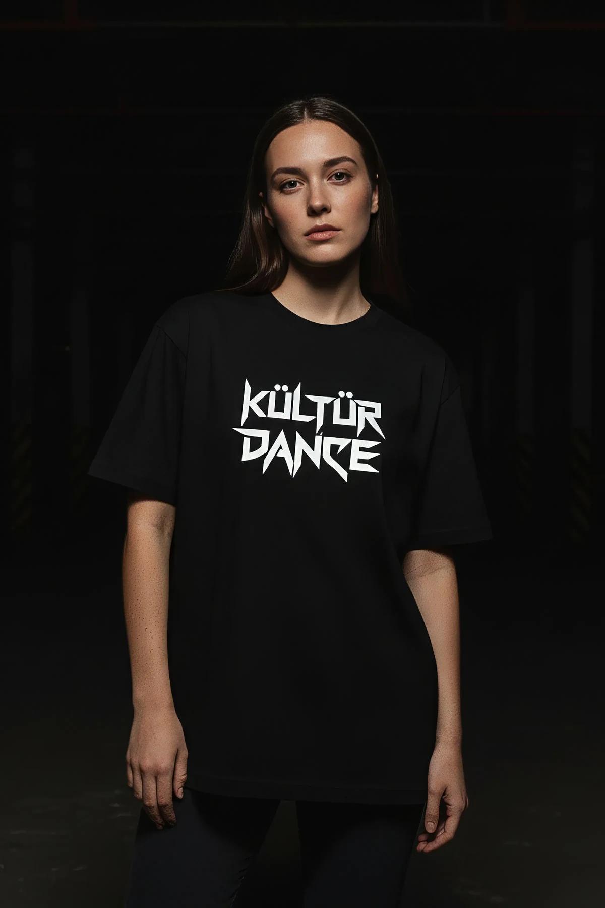 Kültür Dance reflective print detail on black jersey t-shirt under direct light