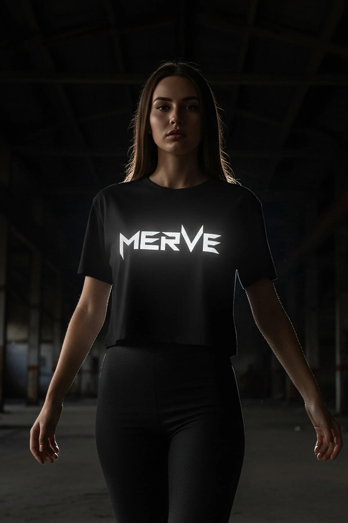 Black cropped T-shirt with reflective logo print worn with black leggings, not a harness product
