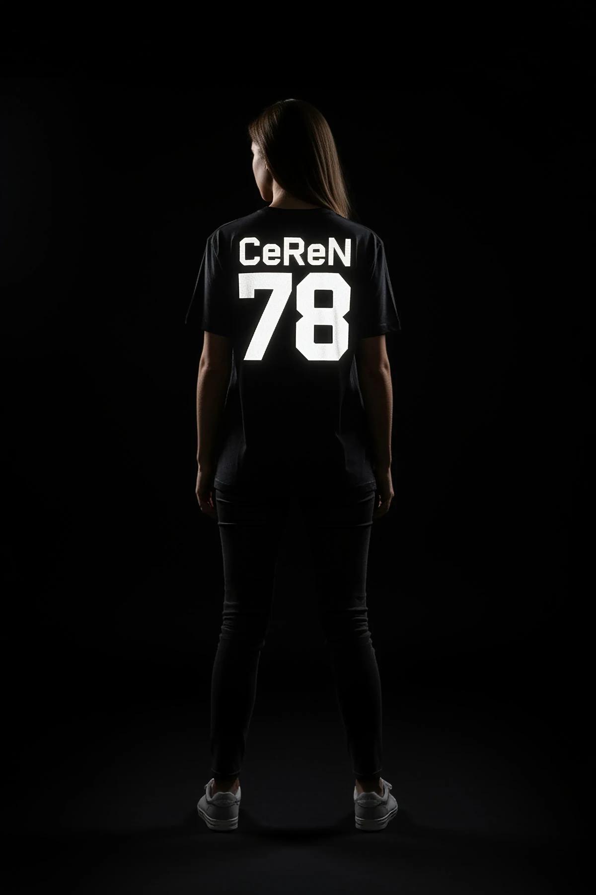 reflective oversized tee grey with bold white glowing custom text print worn at night