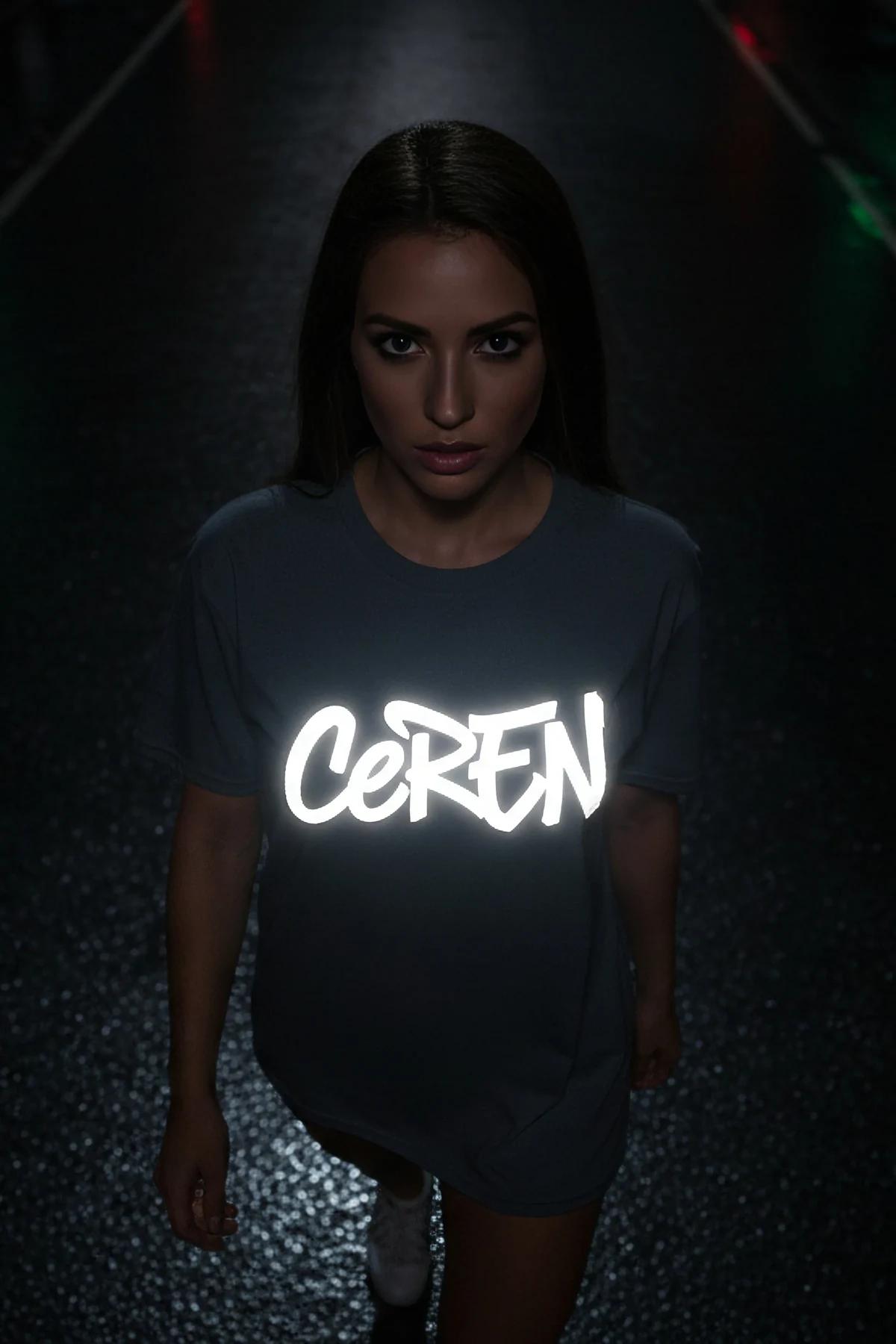reflective oversized tee grey with bold white glowing custom text print worn at night