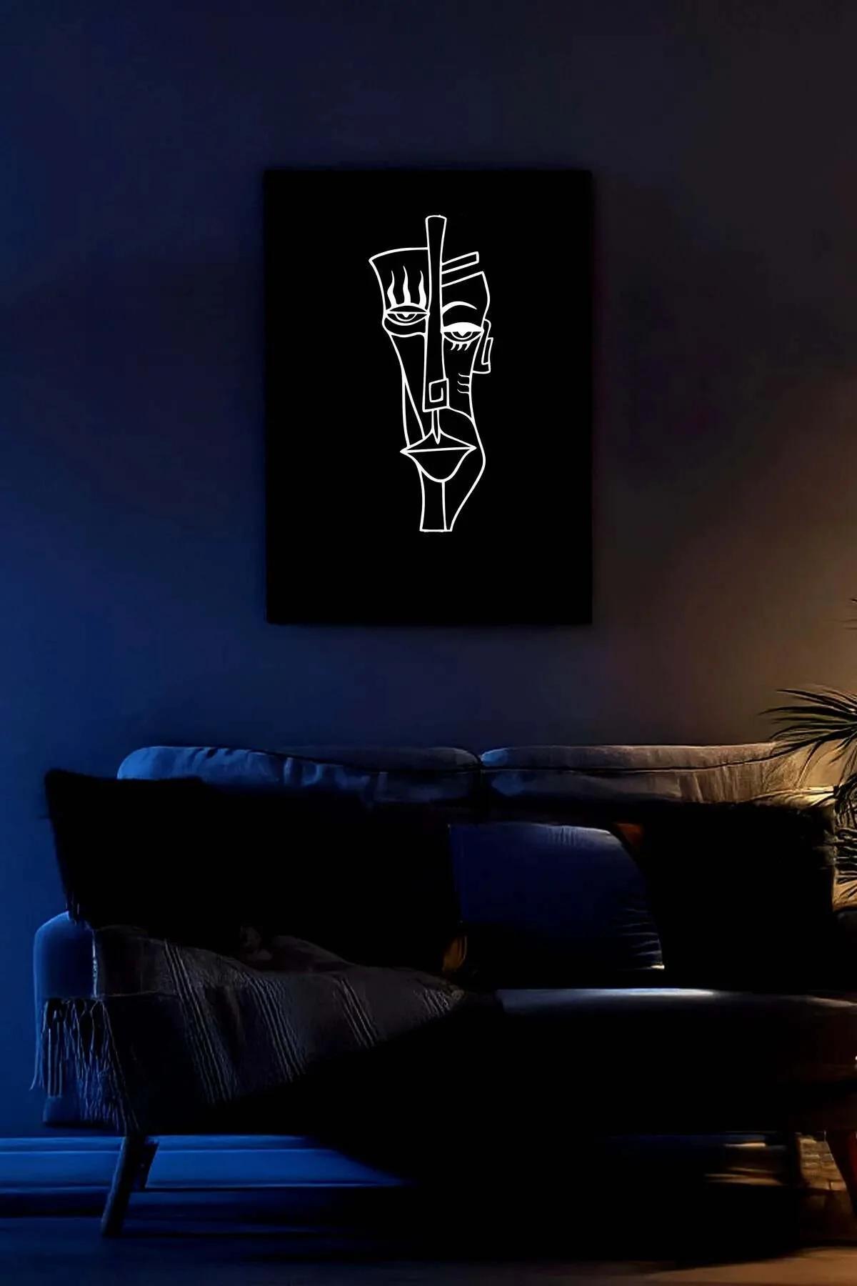 Reflektörlü one-line portre tablo spot ışık altında parlayan beyaz hat detayı