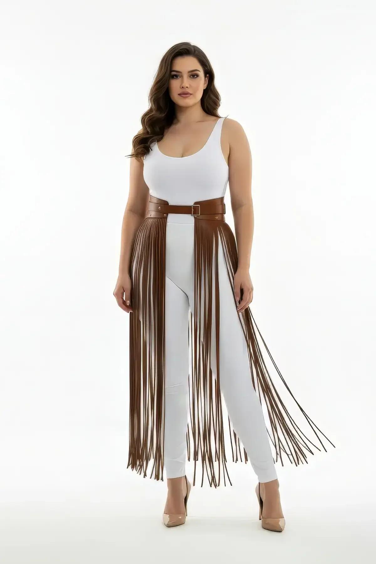 Close-up of brown faux leather waistband with gold rectangular buckle on fringe harness skirt