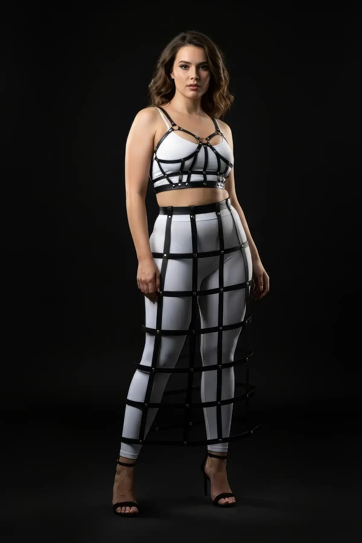 full-length black cage skirt harness layered over white leggings, floor-sweeping silhouette