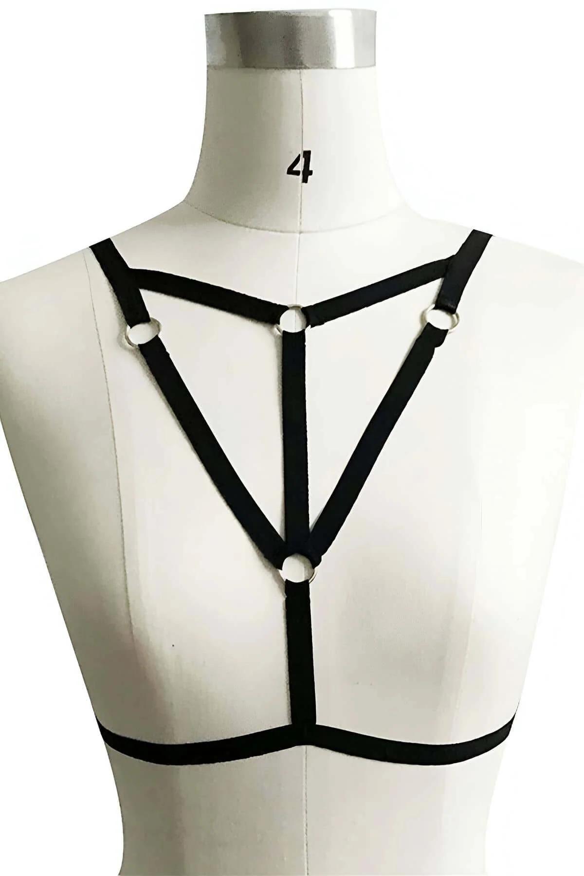 black spandex strap chest harness three-point silver O-ring detail close-up