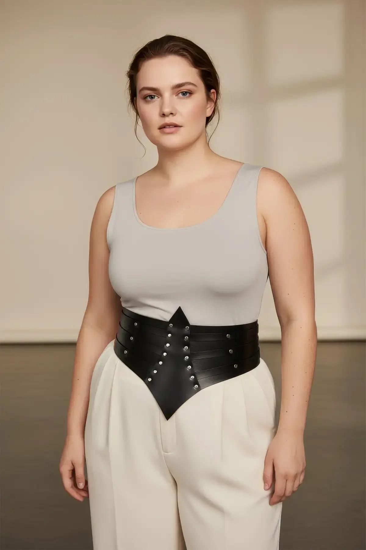 back view of black studded faux leather wide waist belt with hook closure