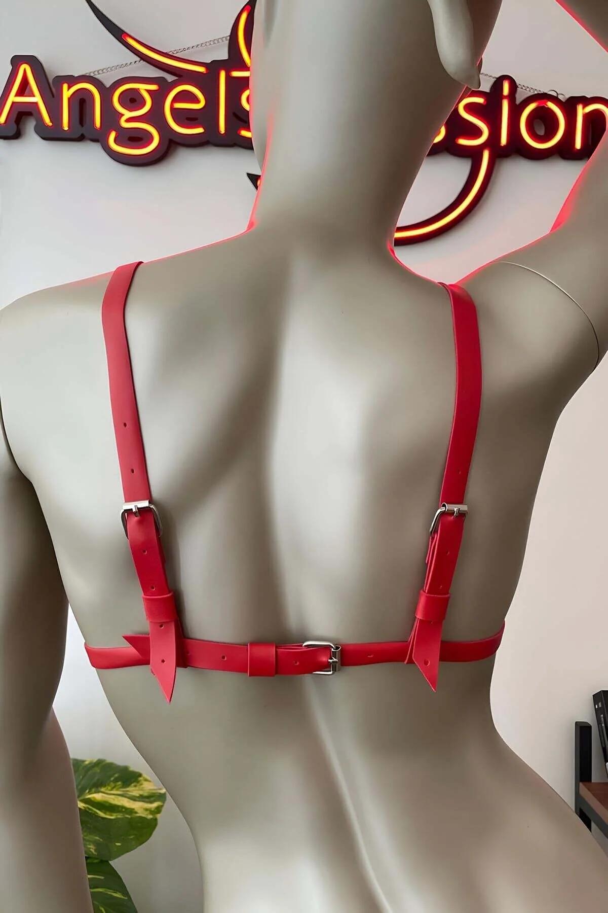 red strappy cage bra lingerie with gold studs worn over torso fashion editorial angle