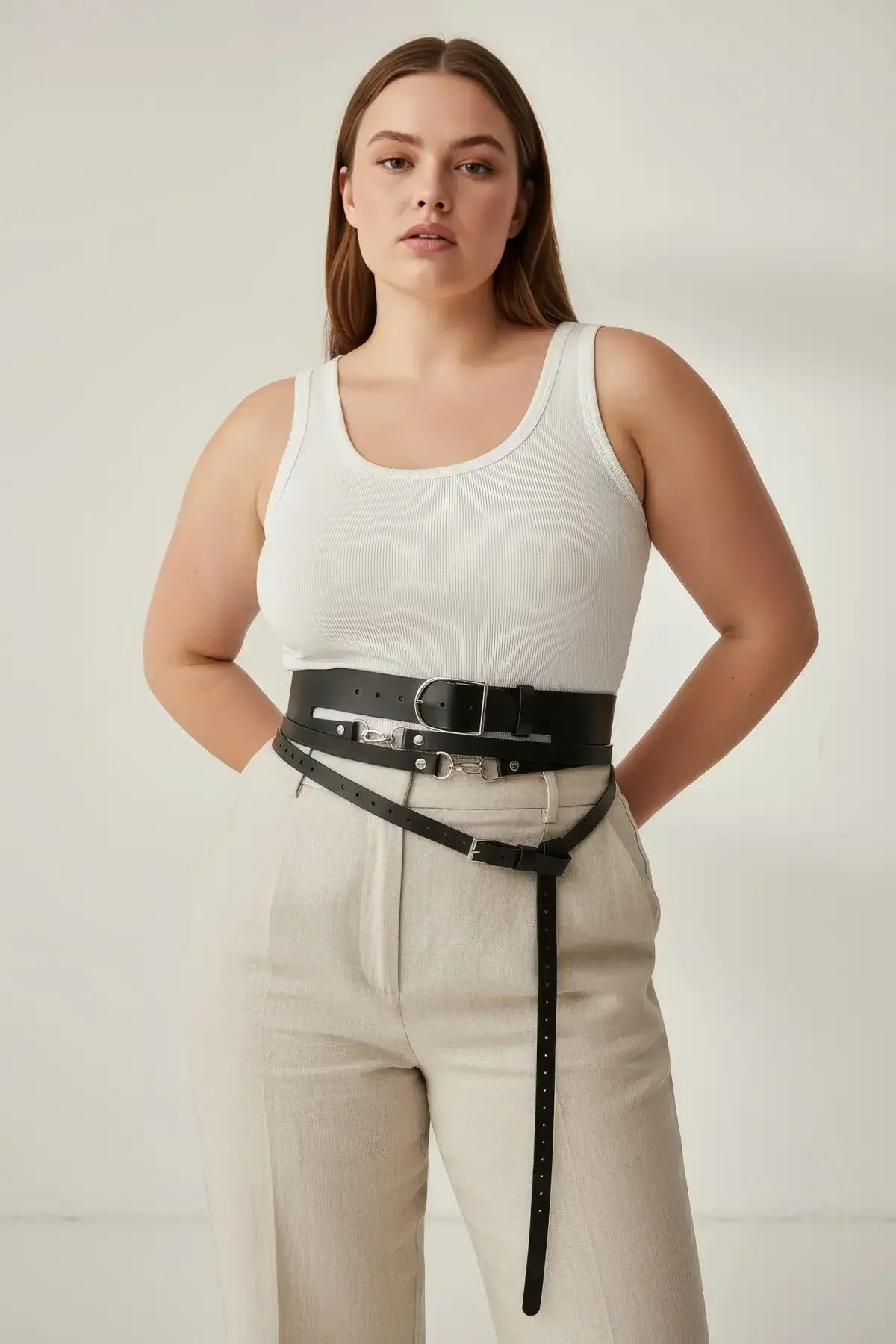 black multi-strap harness belt front-drop vertical strap detail extending below waist band