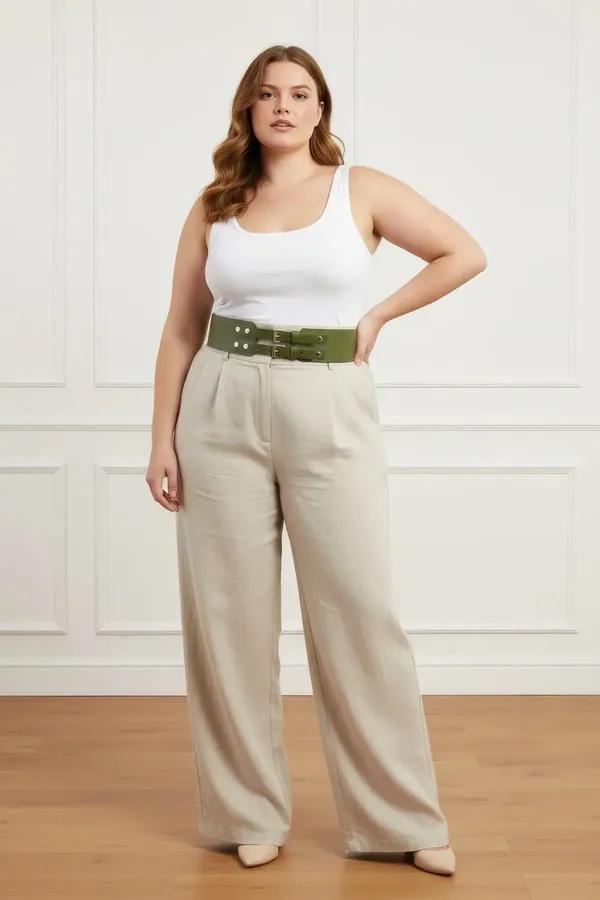 wide olive green faux leather waist belt harness with silver double buckle worn over white tank top