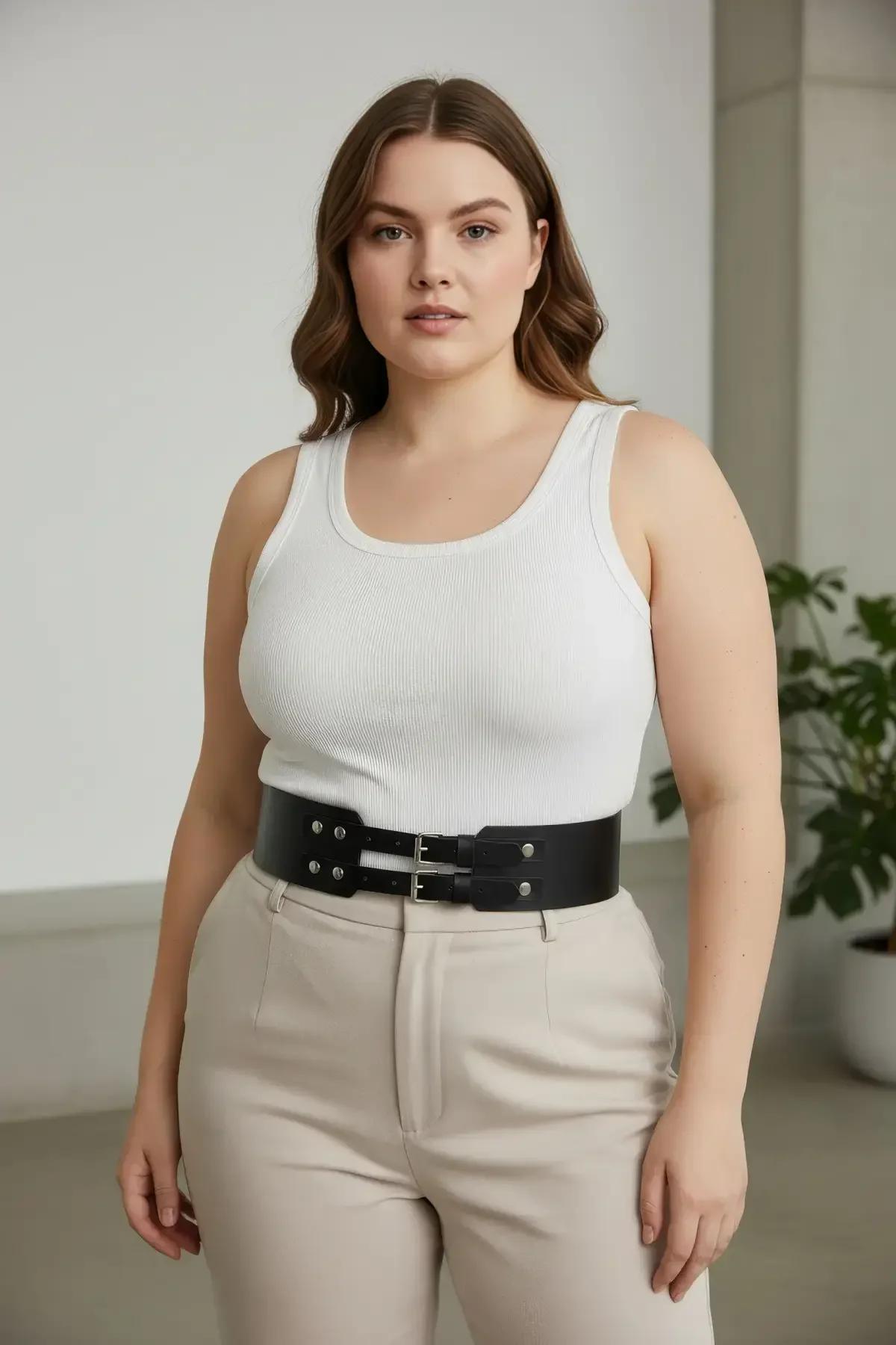 double buckle waspie waist belt close-up of silver hardware and stud trim on smooth matte faux leather