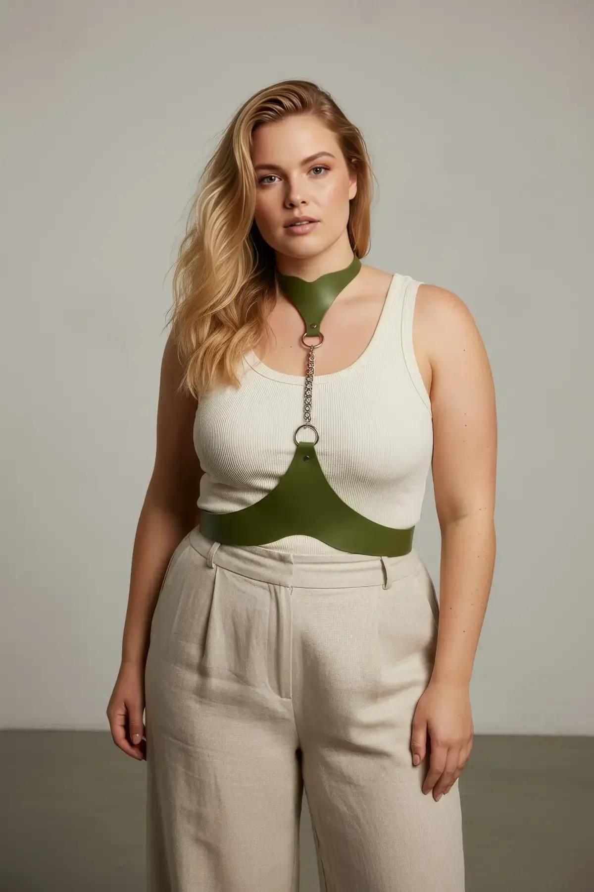 Close-up of silver-tone chain link joining olive green choker to chest harness band