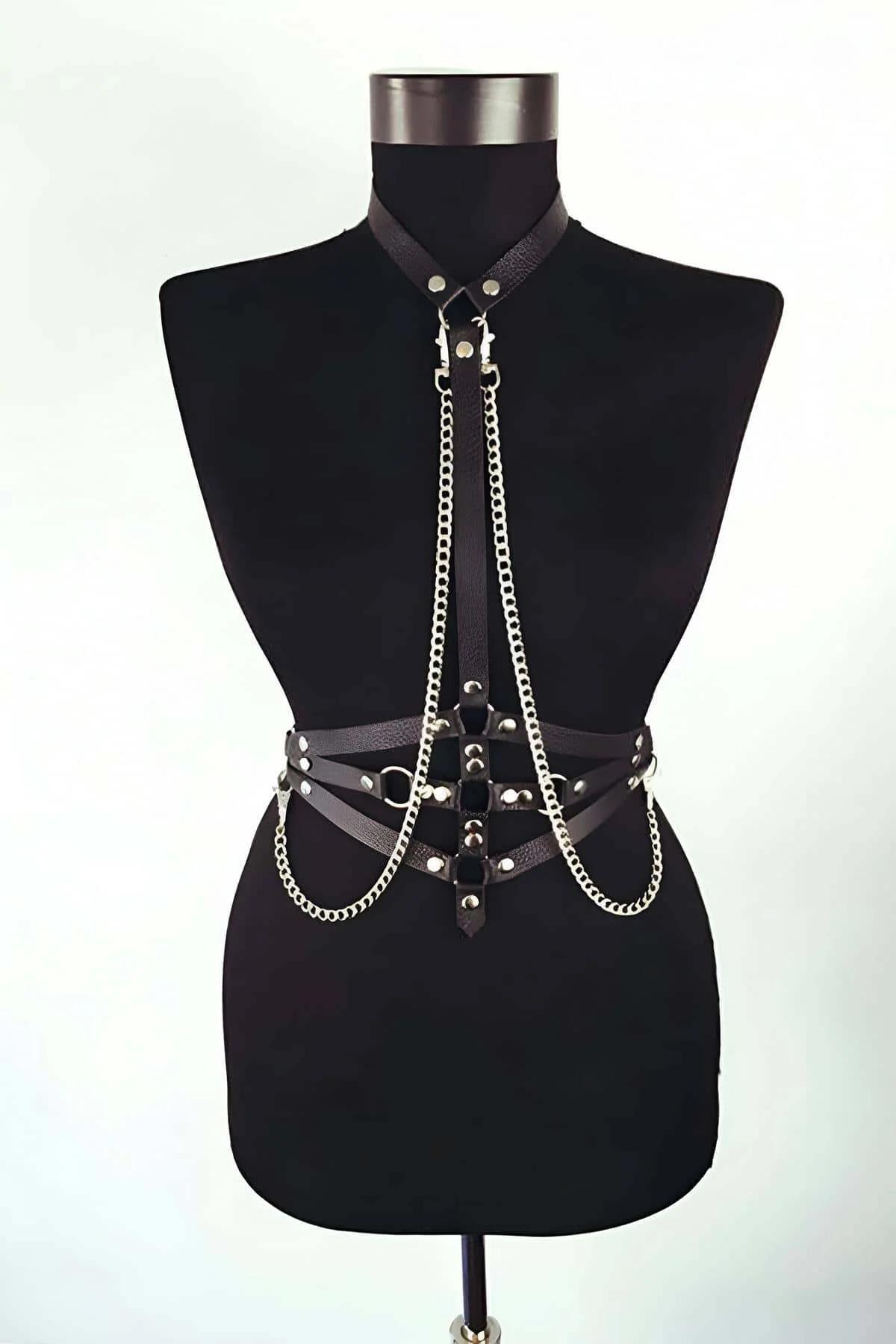 black PU leather choker neckband connecting to vertical chest strap with silver rivet studs and hanging chain