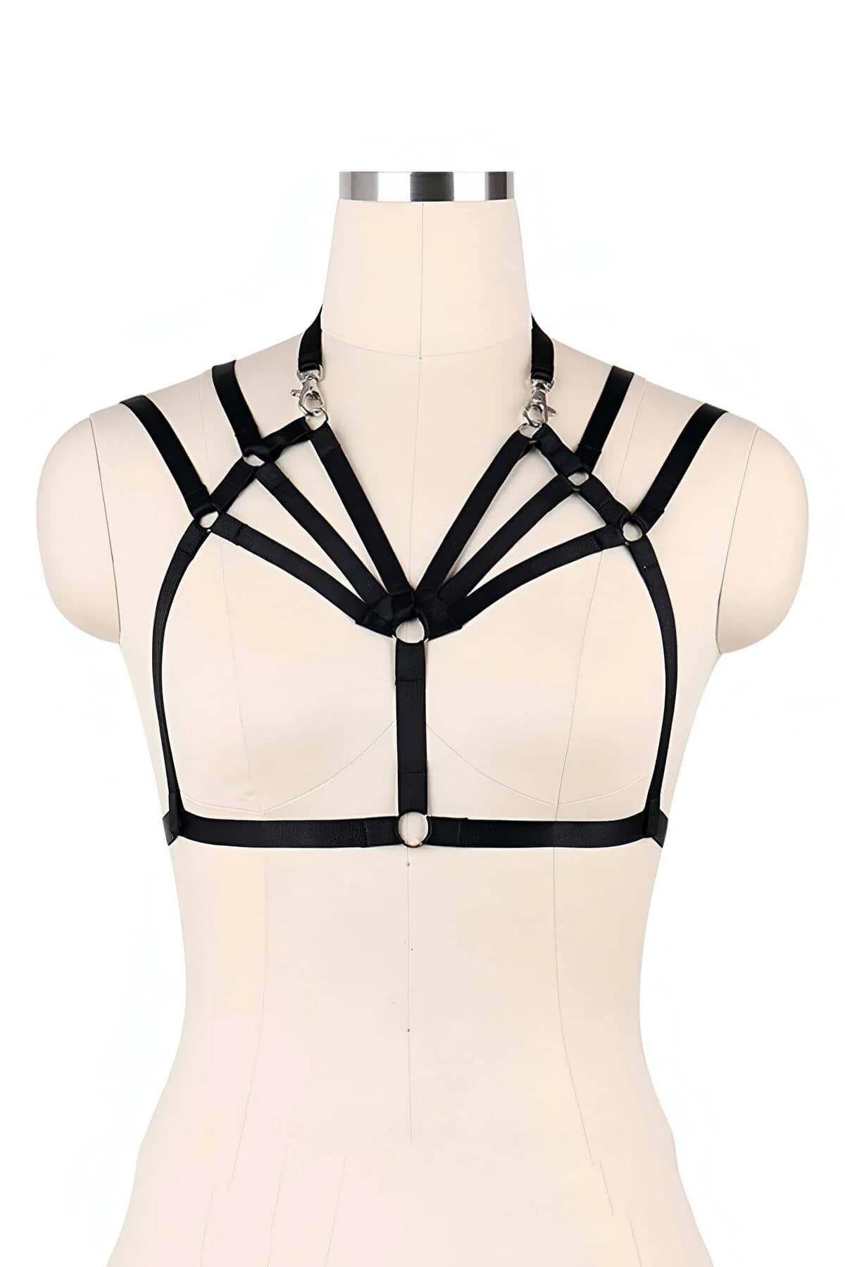black three-strap chest harness worn over nude bralette party fashion styling
