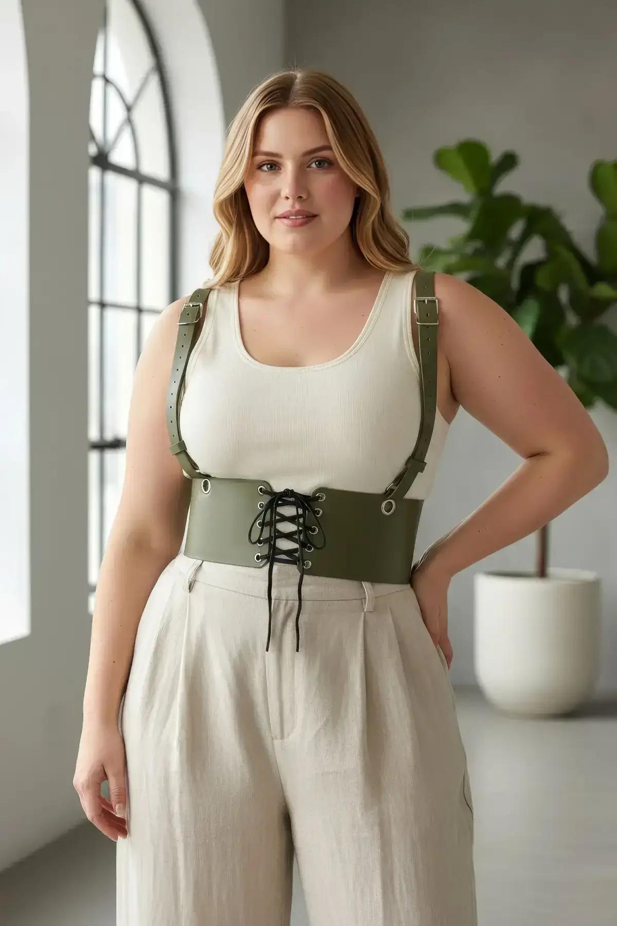 olive green body harness corset belt styled with wide-leg trousers and ribbed white top
