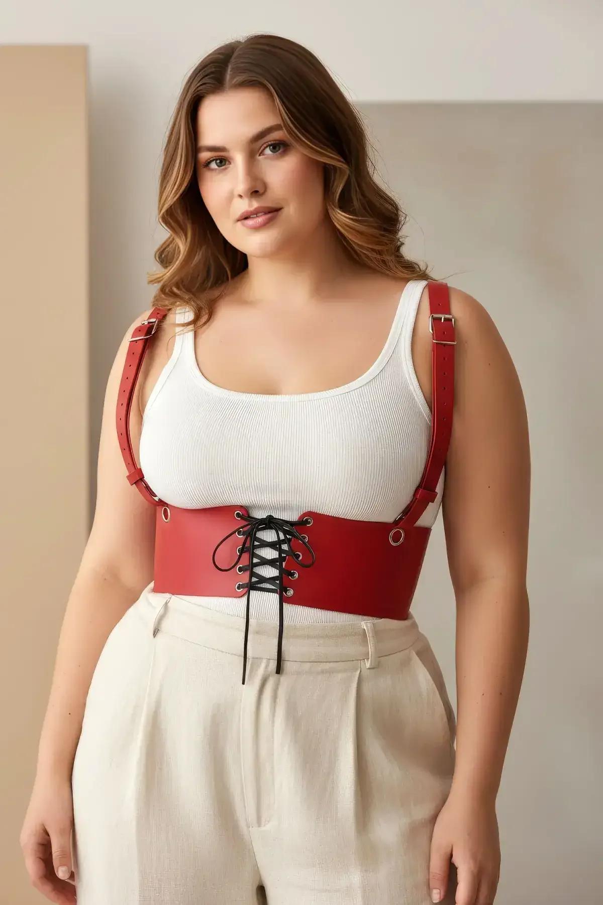Back view of red underbust body harness showing adjustable shoulder strap buckles and smooth PU leather finish