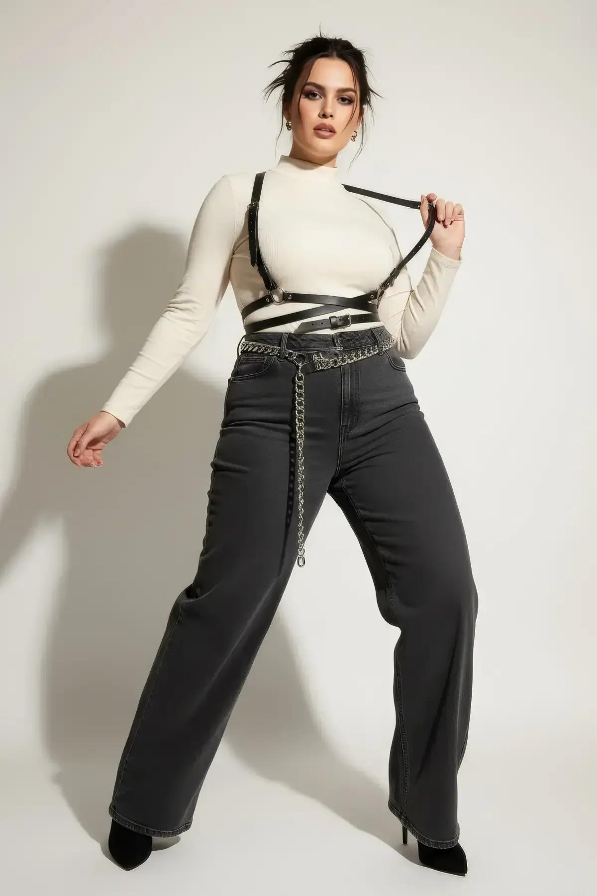Cross-strap faux leather underbust harness front view showing geometric overlapping black straps