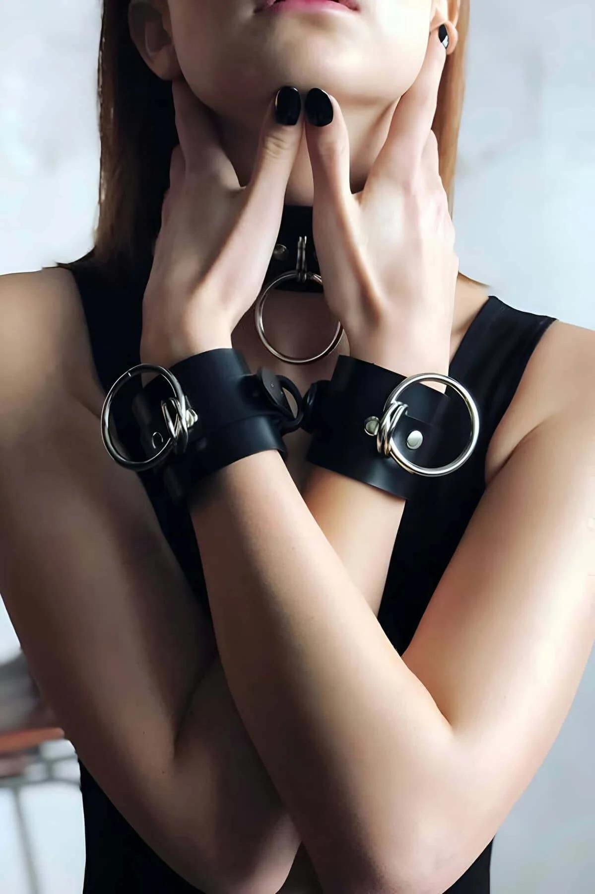 close-up black faux leather choker collar gold O-ring snap stud detail front view