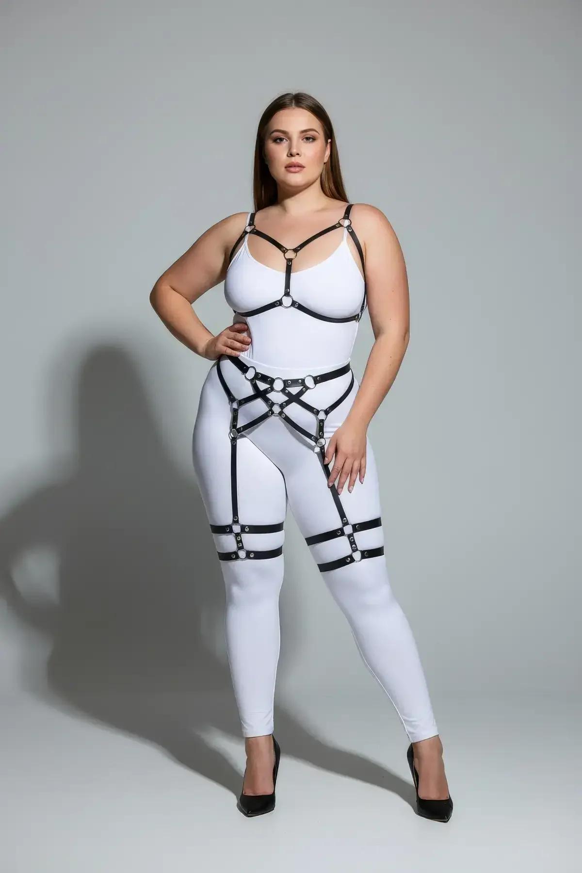 Black vegan leather body harness chest section with silver O-rings and V-neckline strap frame