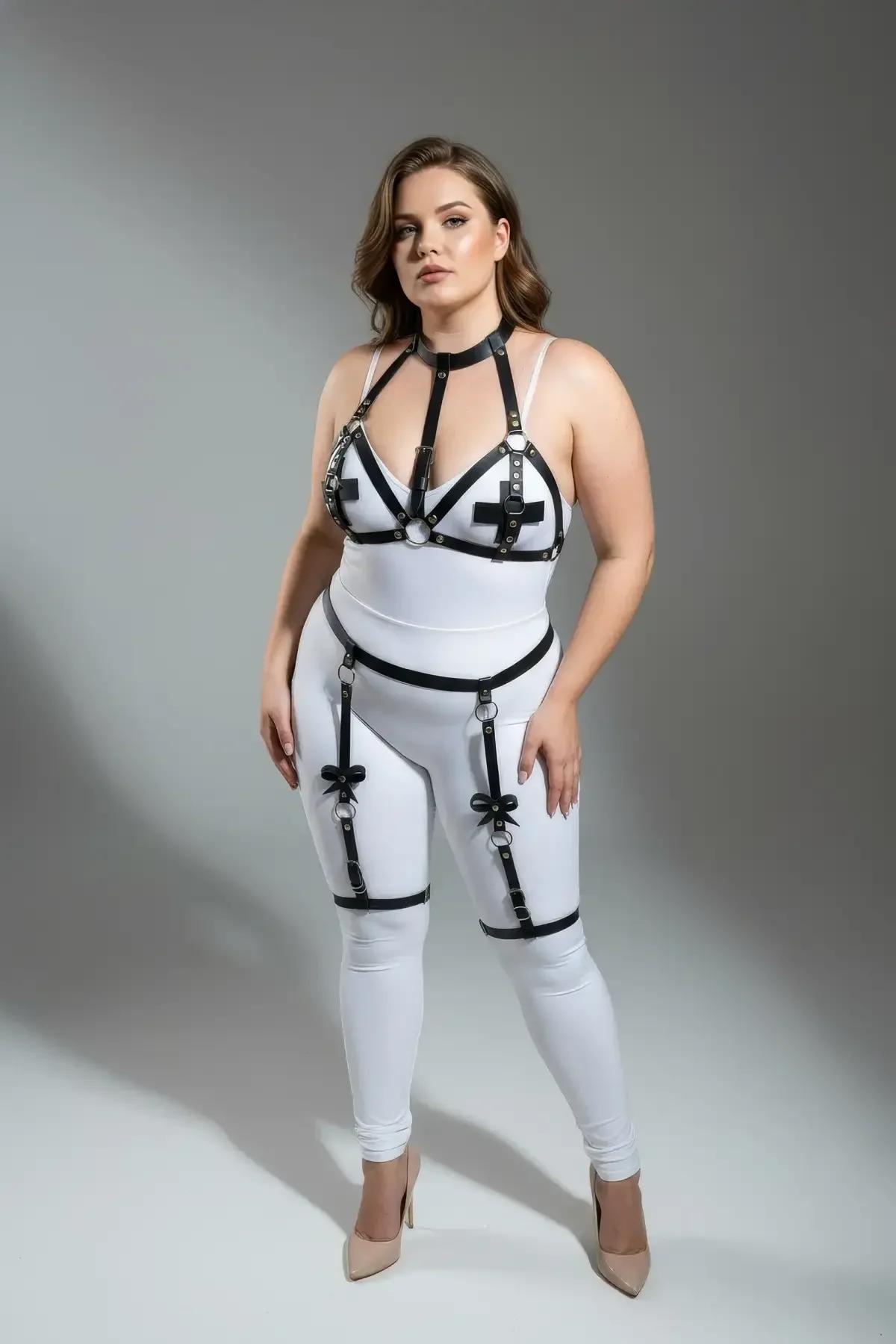black faux leather chest cage harness with cross hardware and central silver O-ring detail