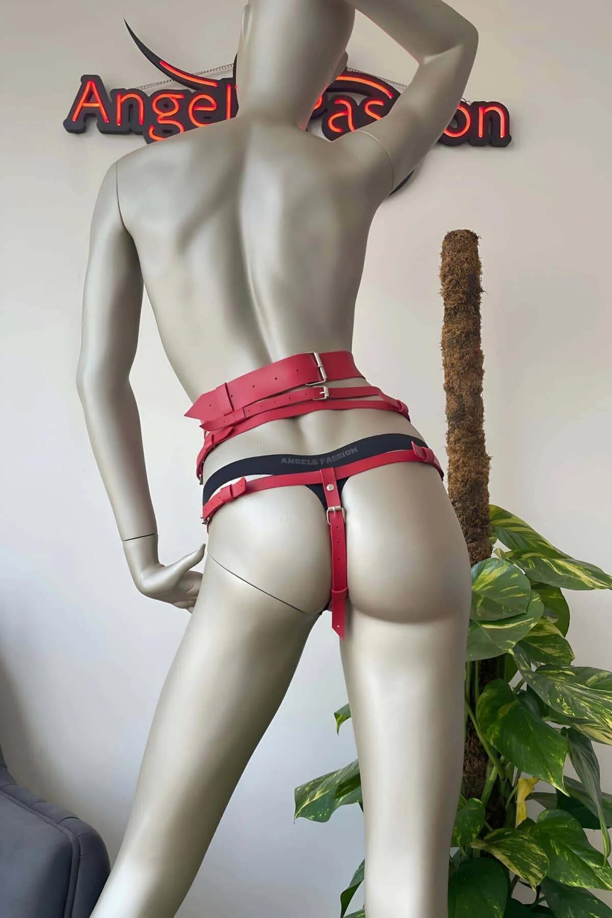 red faux leather thigh garter clip with tassel fringe detail hanging below harness