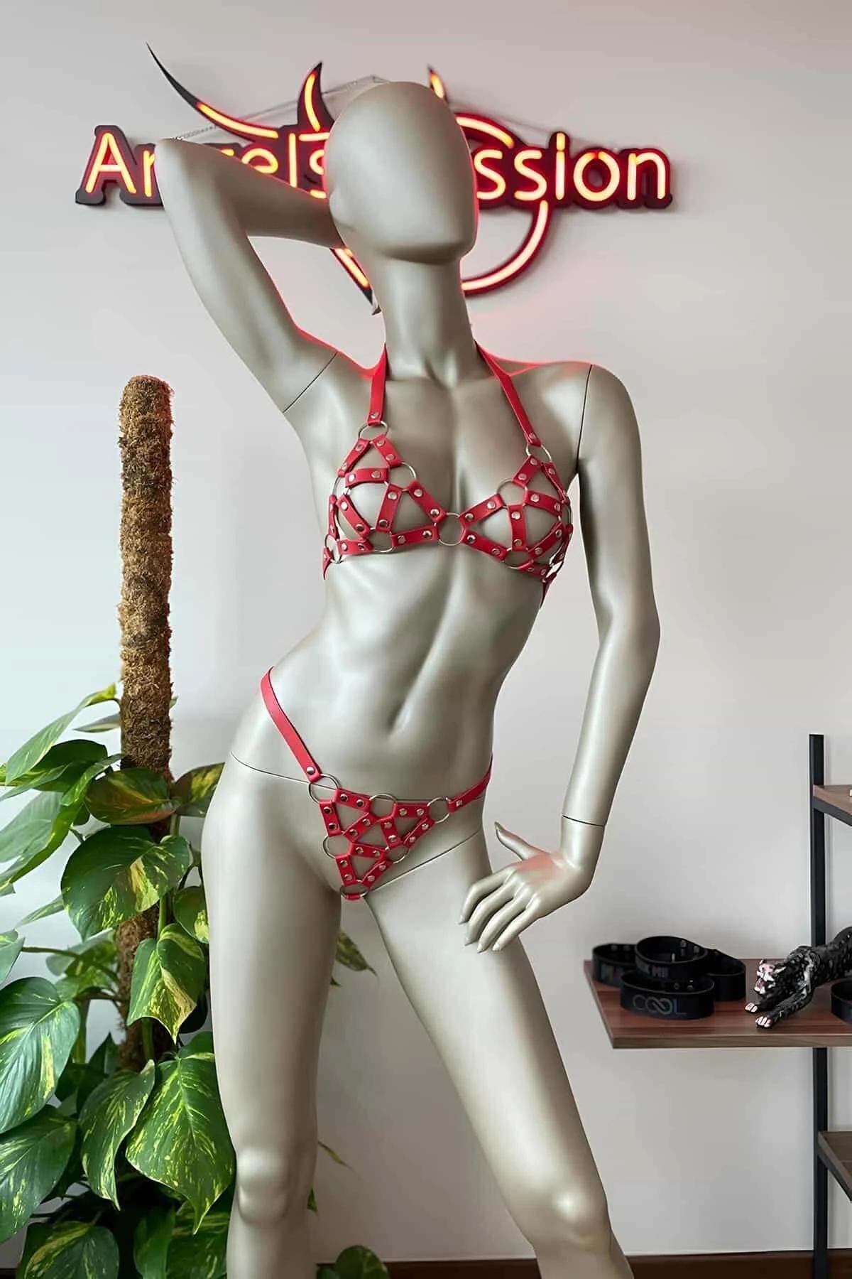 red PU leather cage bra harness top with triangle pattern and silver O-rings front view