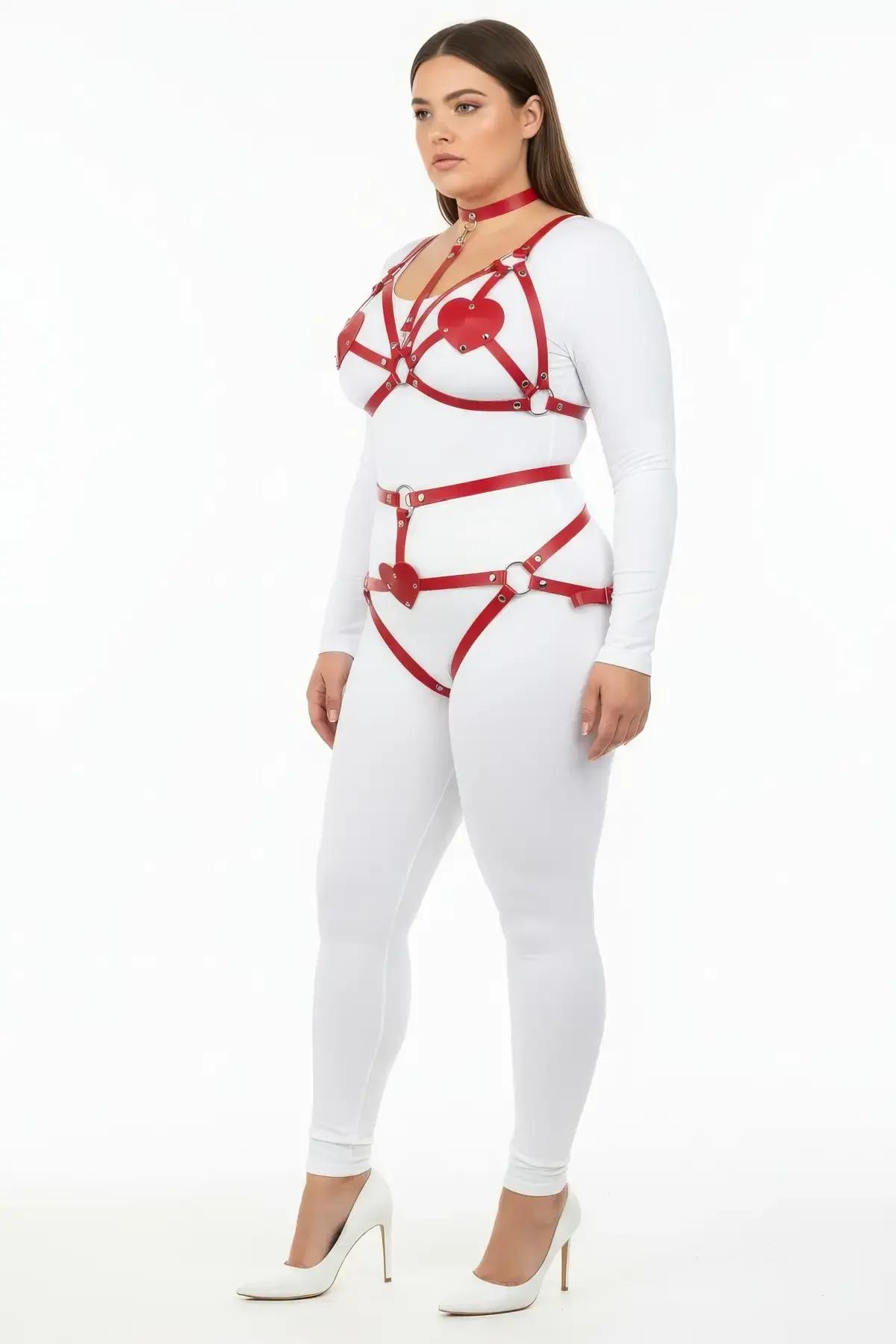 red faux leather chest harness with silver O-ring centre and heart-shaped bust patches detail close-up