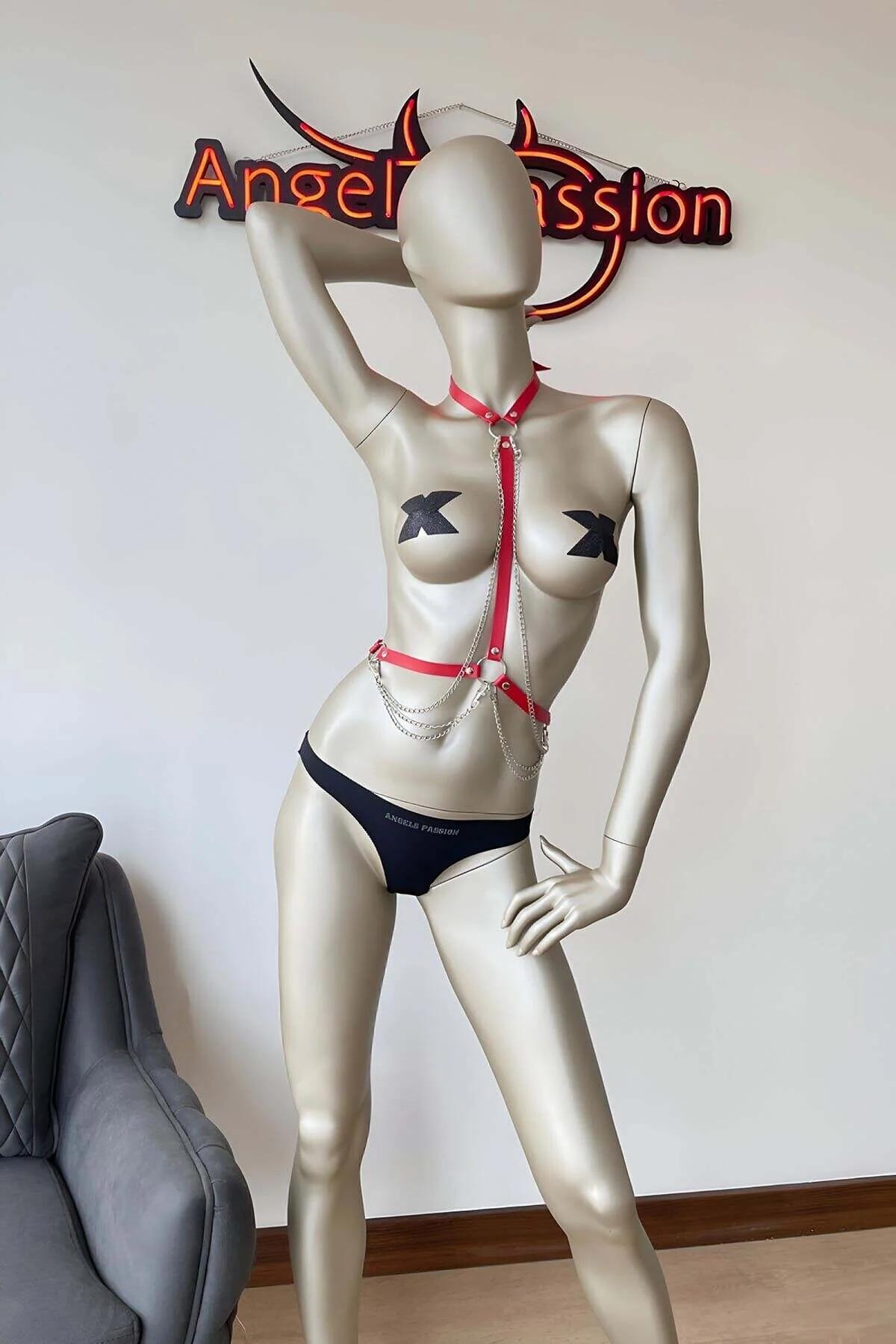 red faux leather body harness with 3-layer silver chain draped at waist side angle