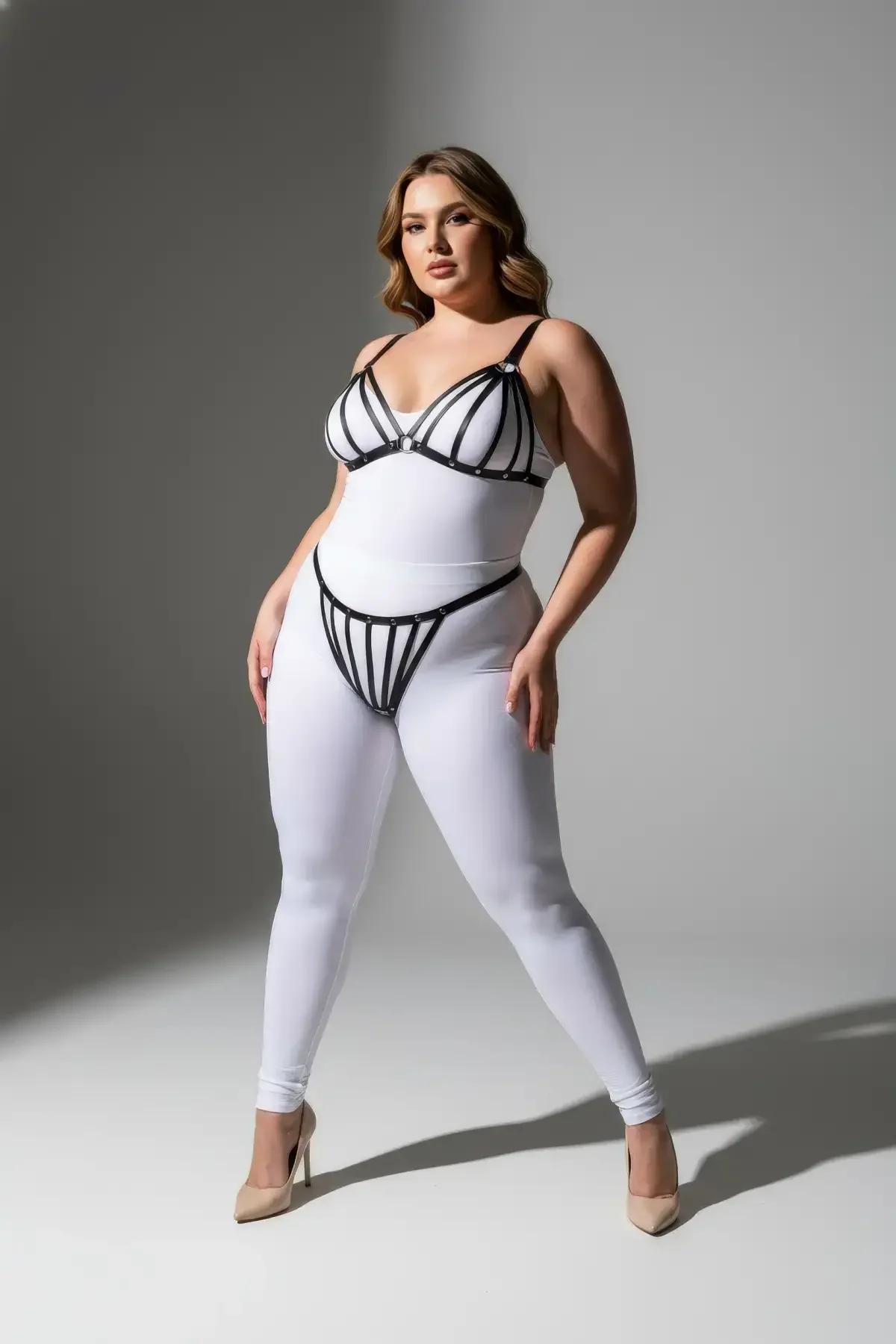 matching black strappy thong with vertical faux leather bands and silver studs at waistband