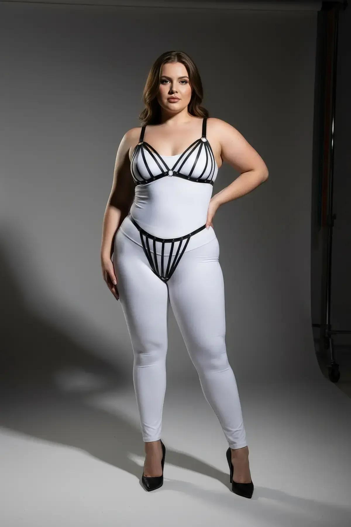 plus-size black faux leather harness bra and thong set front view showing strap configuration