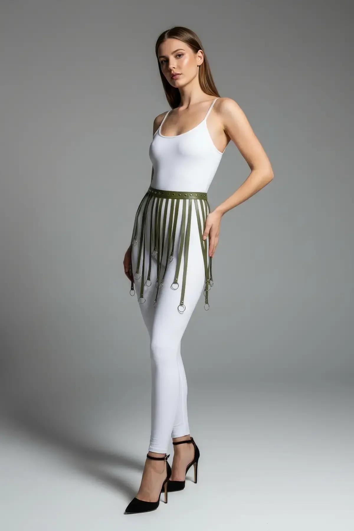 Back view of khaki faux leather fringe harness skirt with buckle closure detail