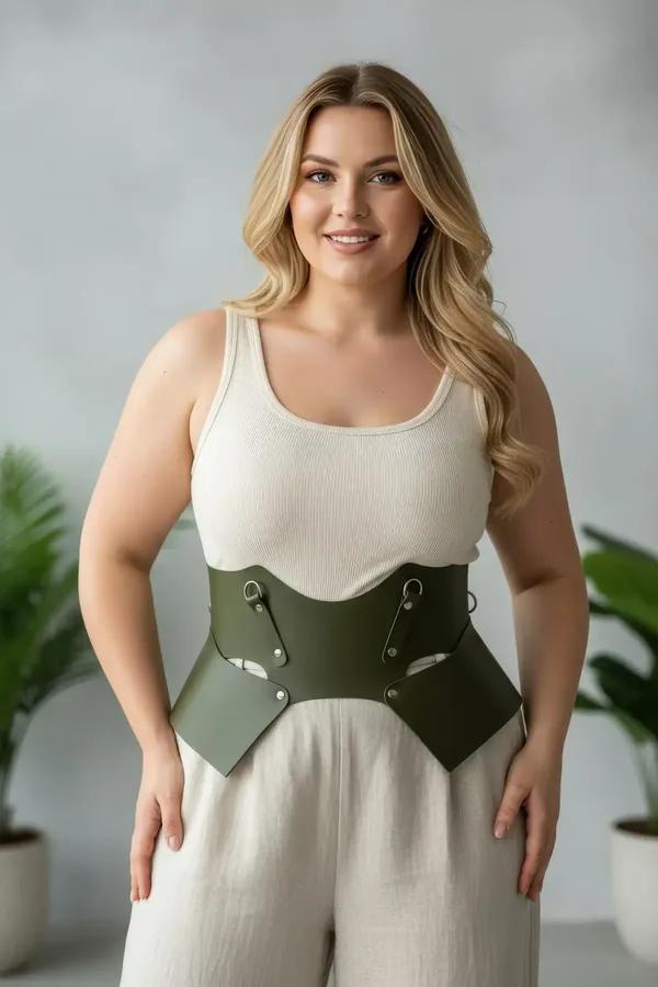olive green wide faux leather waist harness belt with geometric cut-out panels and silver D-ring hardware