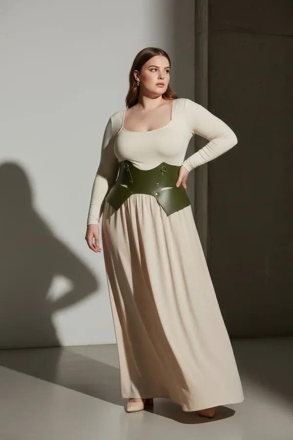 olive green wide faux leather waist harness belt with geometric cut-out panels and silver D-ring hardware