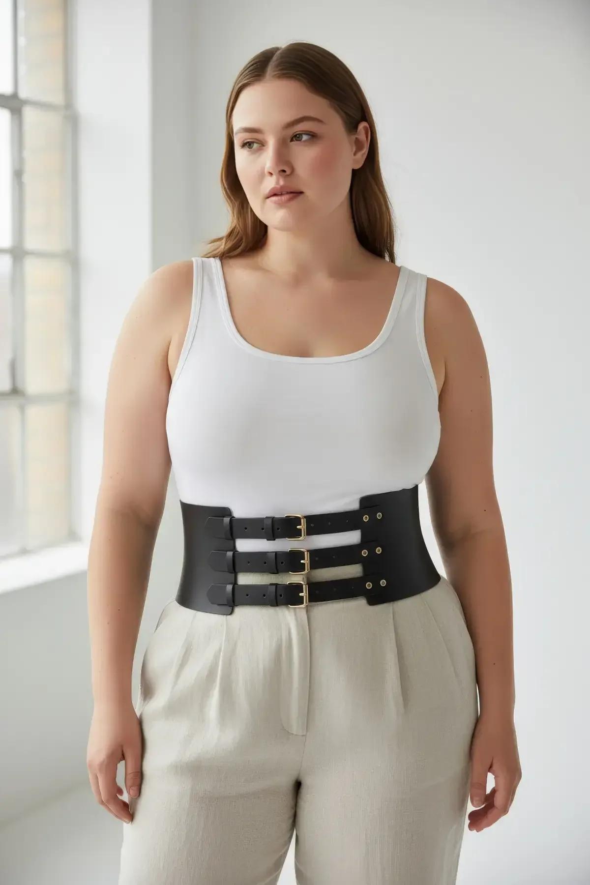 wide black faux leather waist cincher belt with horizontal slot cutouts and three buckle straps