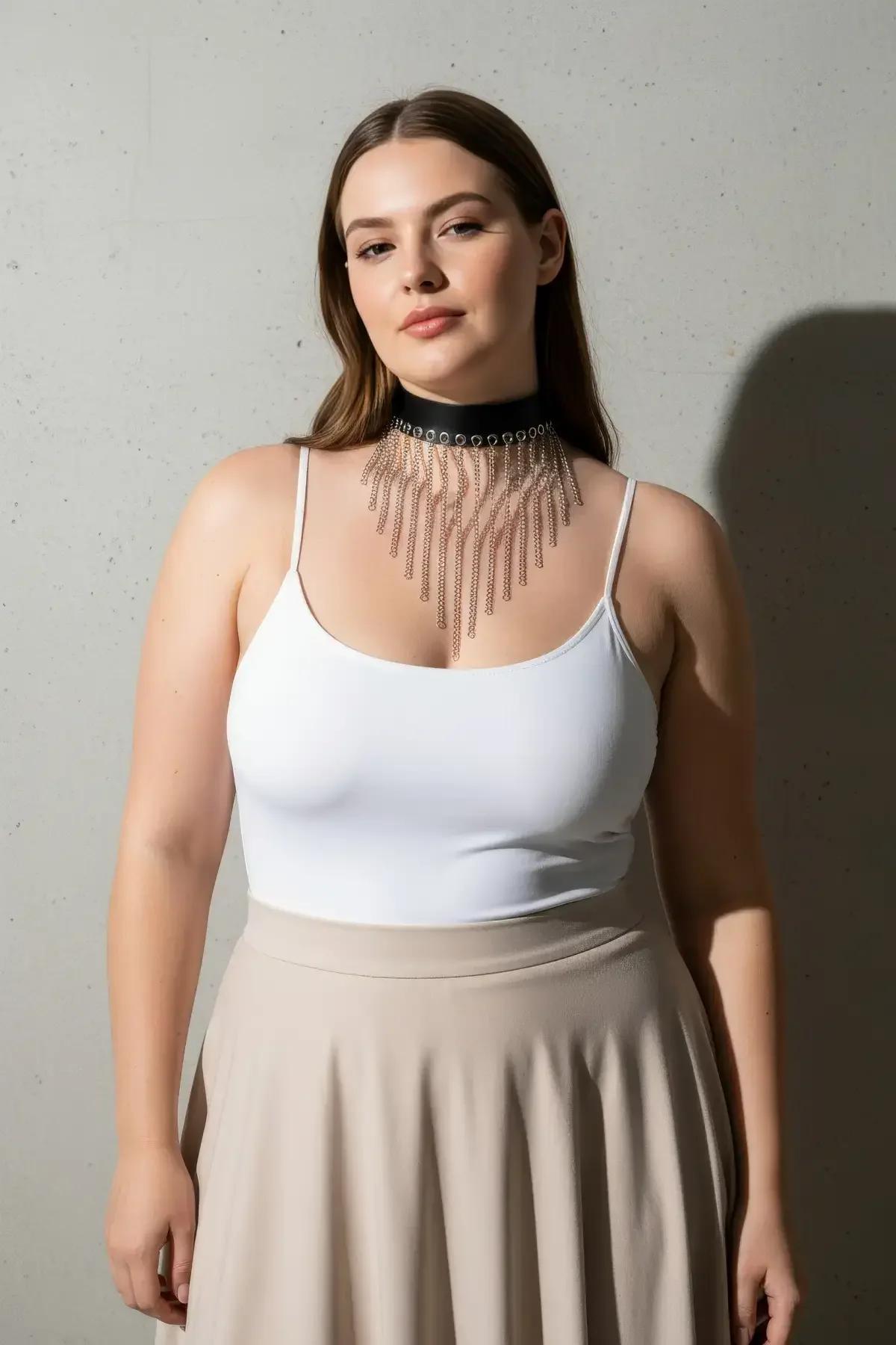 plus size model wearing charcoal choker chain harness over neutral top full look