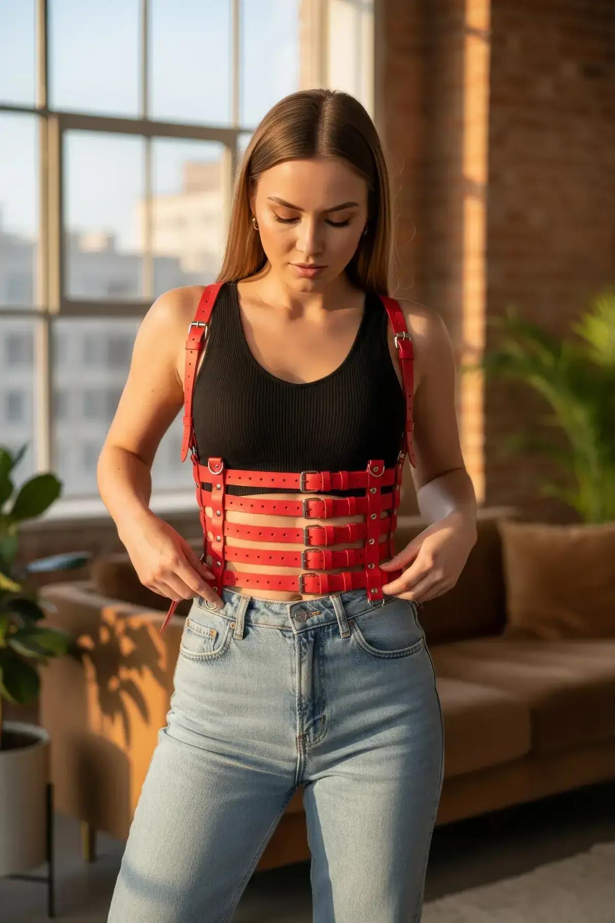 red vegan leather cage harness close-up showing five silver pin buckles and 1.5 cm strap detail
