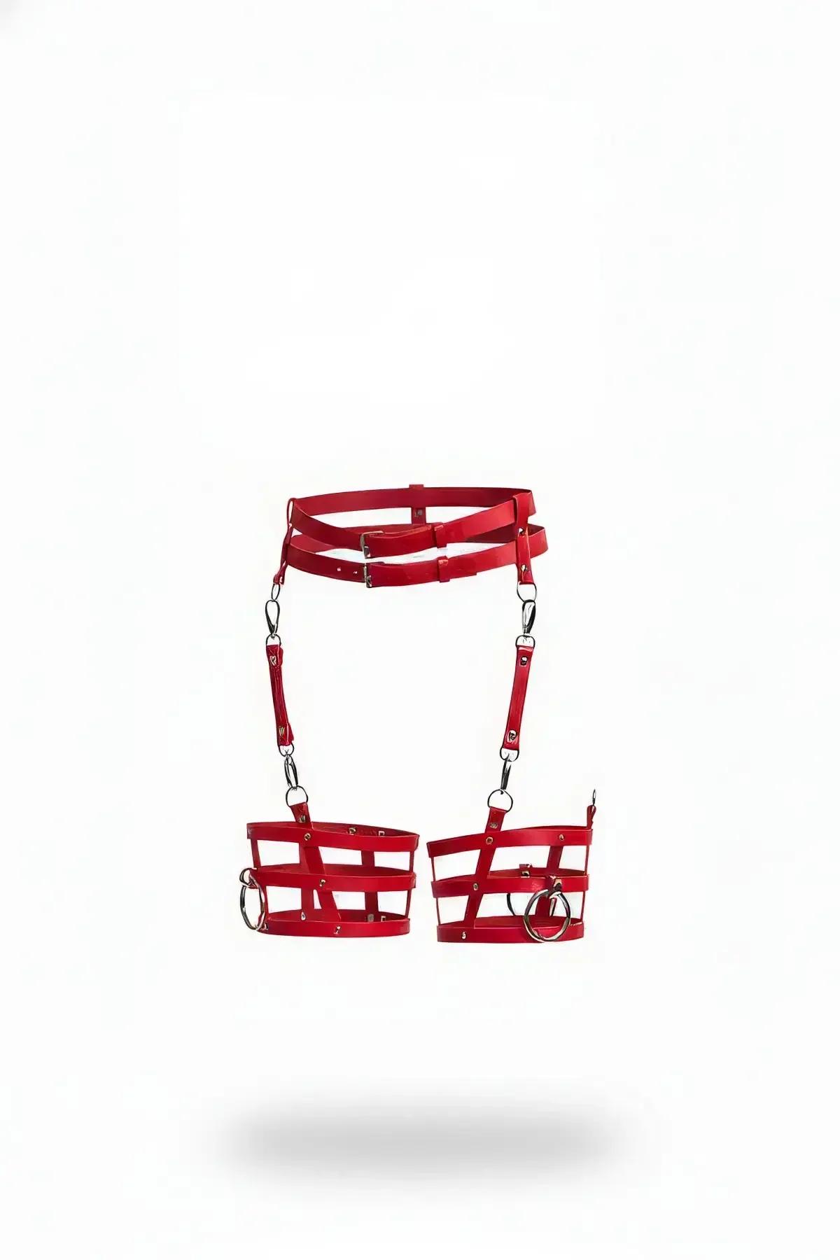 Red faux leather caged leg garter harness with silver O-rings and chain drop suspenders on white background