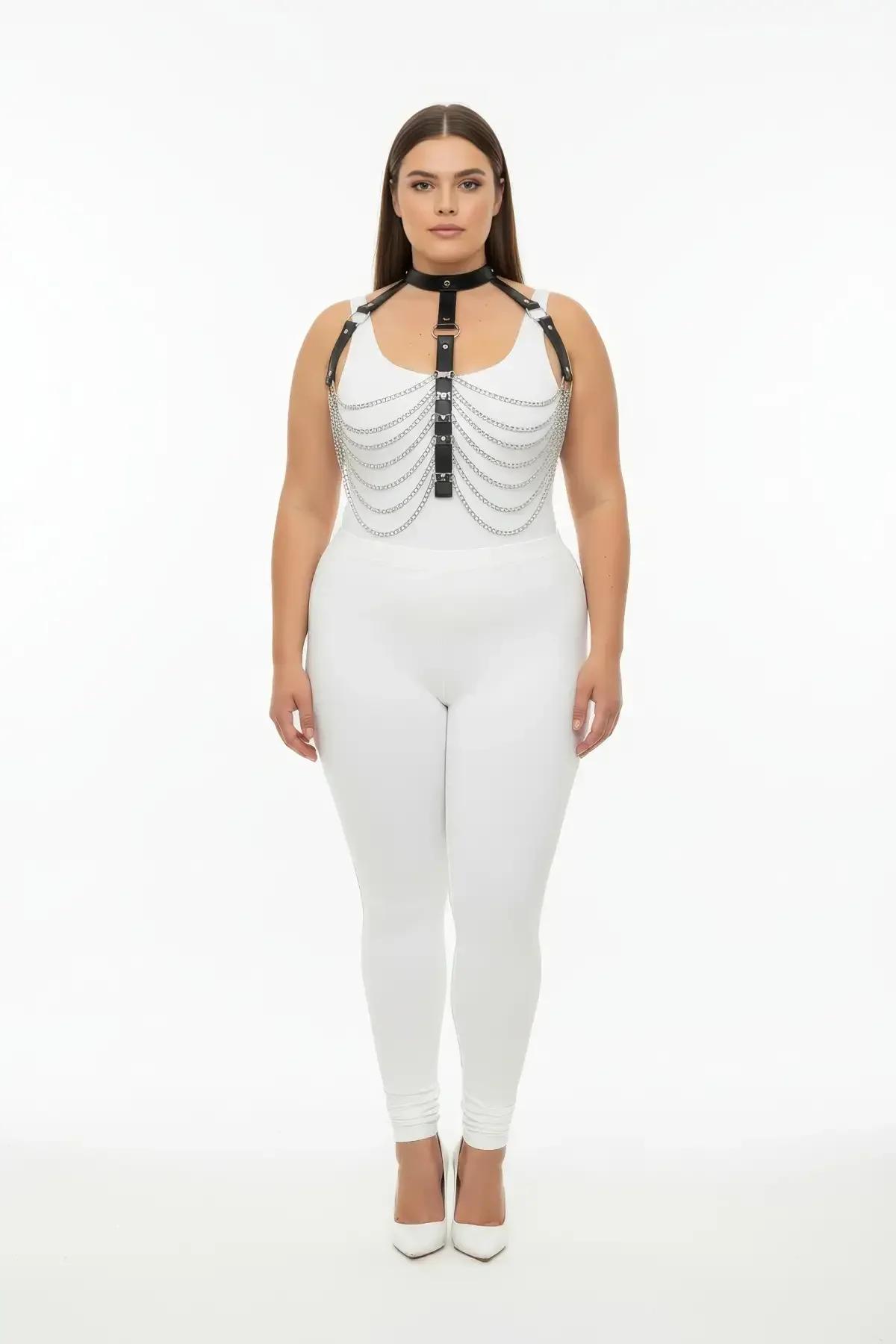 close-up of silver chain drape detail on black faux leather chest harness with riveted hardware