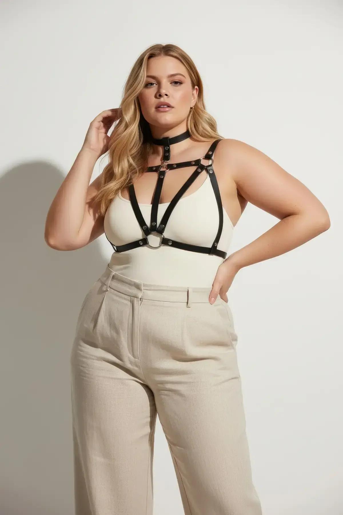 front view of black strappy cage chest harness showing three-band structure and adjustable buckles