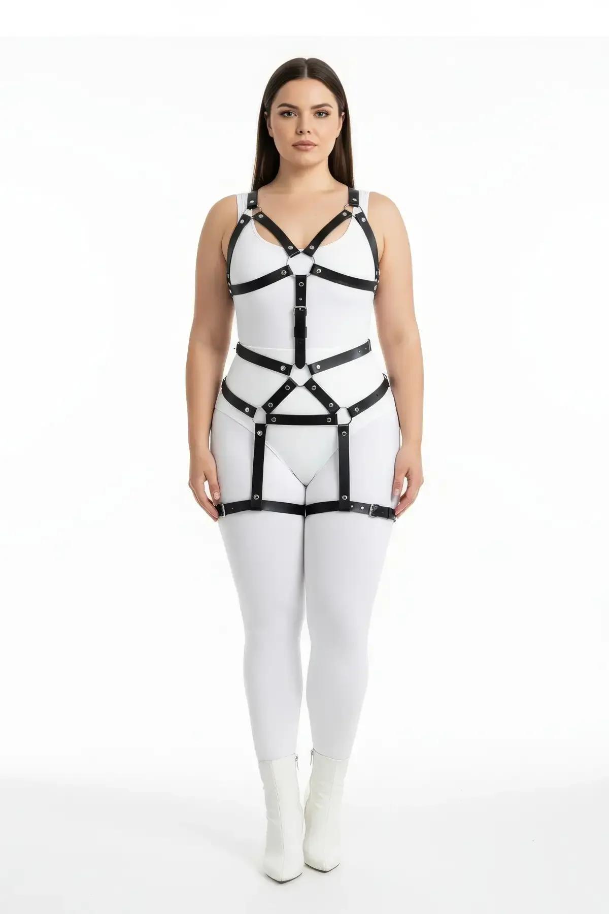 Black faux leather chest cage harness with V-shaped shoulder straps and central silver O-ring on plus size model