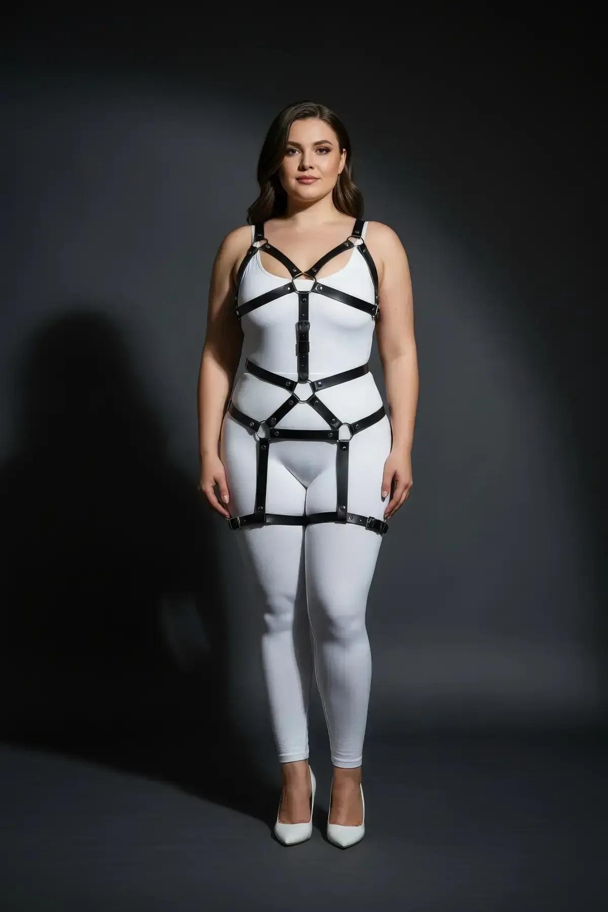 Black full body harness waist band with front buckle closure worn over white bodysuit