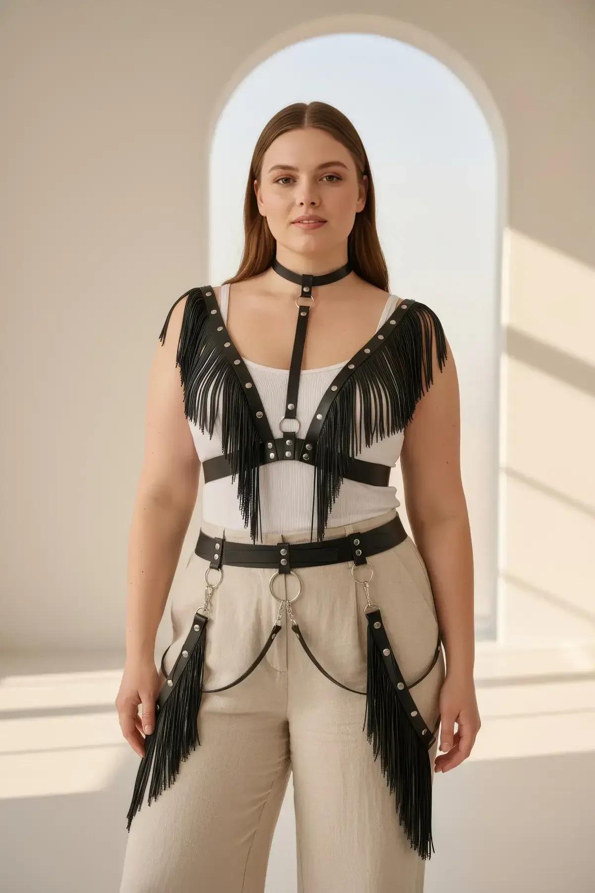 full-length view of black faux leather body harness with cascading 20 cm fringe and detachable silver hip chains