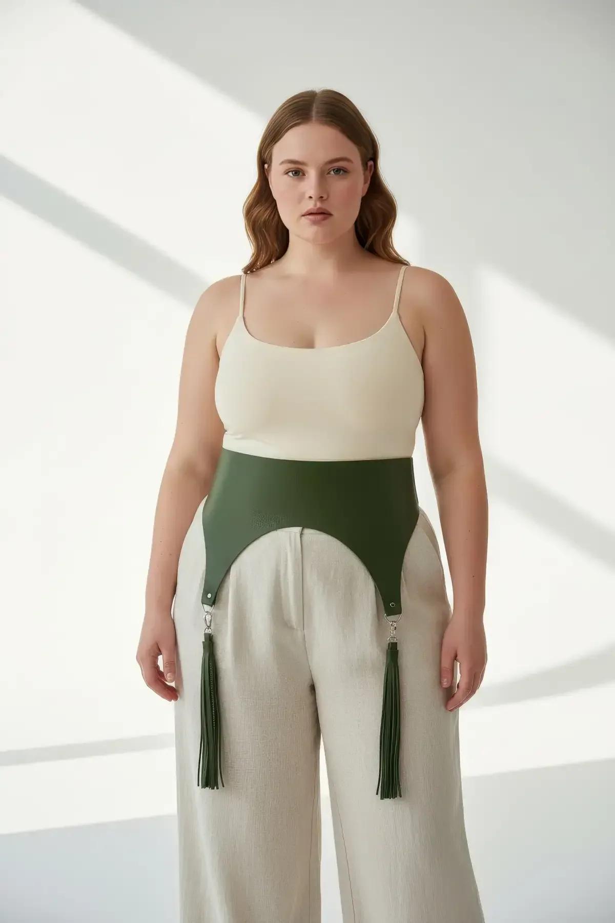 front view olive green structured wide waist harness band with two hanging faux leather tassels
