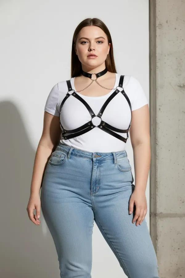 black faux leather caged chest harness with silver choker and detachable body chain worn over white tank top