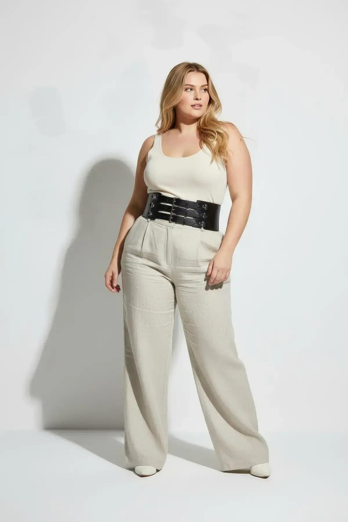 wide faux leather waist harness belt styled over wide-leg linen trousers