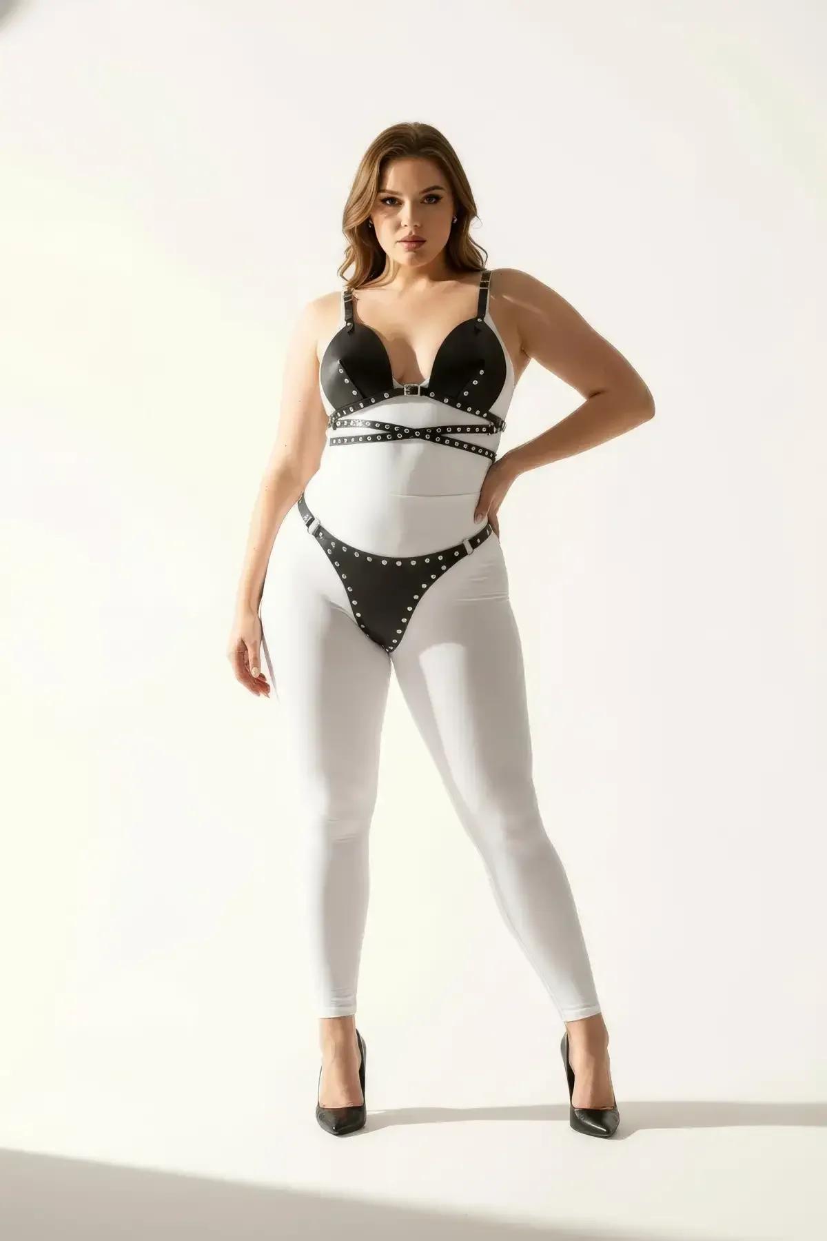 rear view of black faux leather studded harness set showing adjustable back strap closure