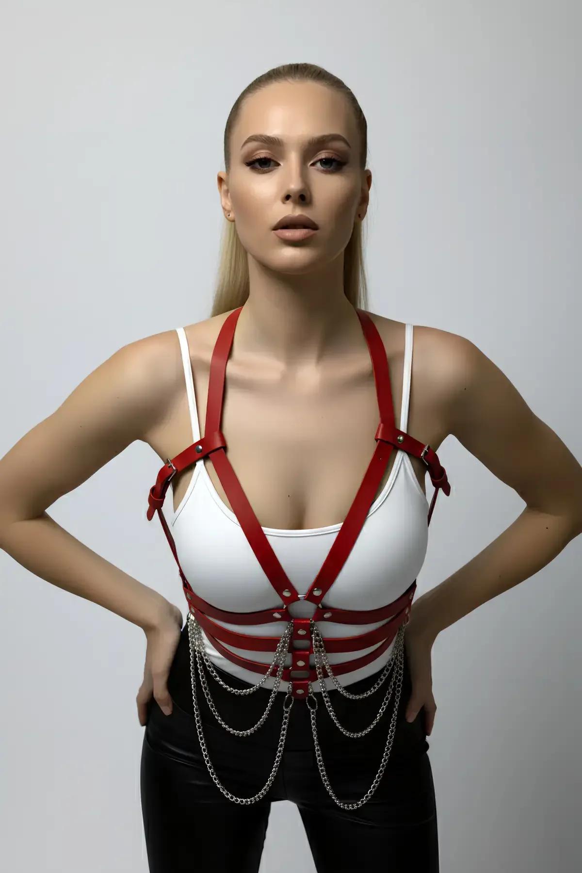 close-up red PU faux leather chest harness showing central O-ring and adjustable shoulder buckles