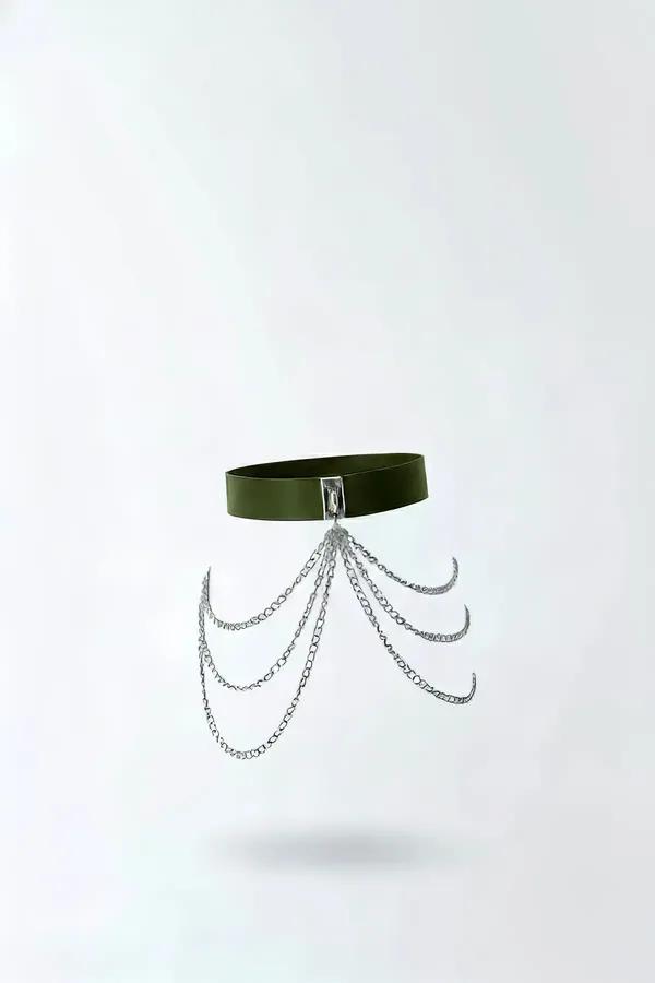 olive green faux leather waist harness with five draped silver-tone chain swags and rectangular buckle closure